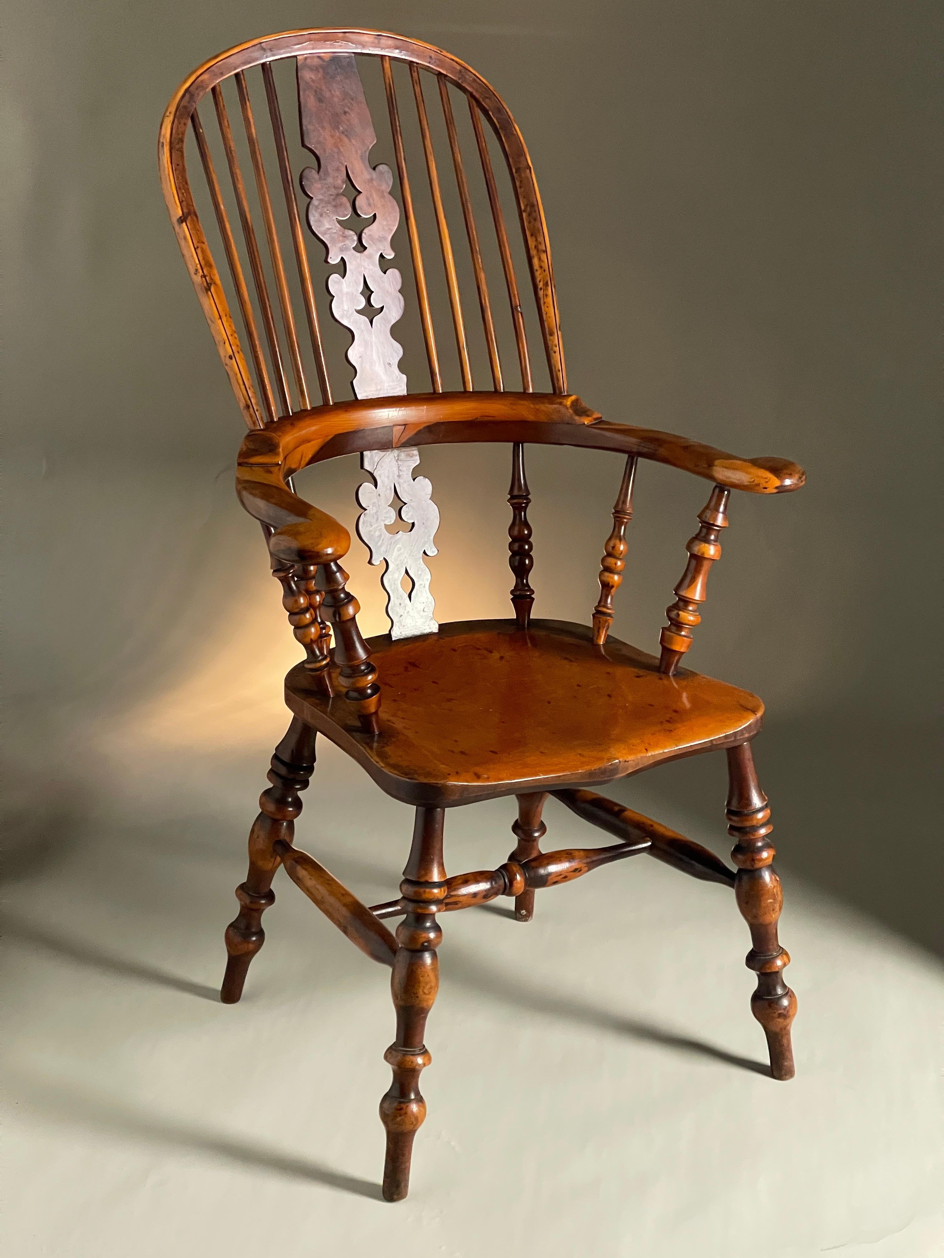 Wonderful yew Windsor chair excellent colour and patination 19th century broad arm and burr splats. 
Size 115cms high 68cms wide 57cms deep

