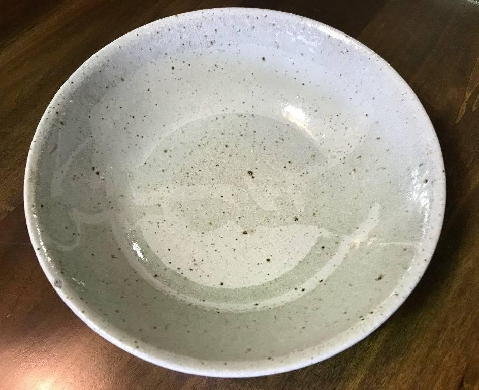 Beautiful in it's subtlety and pale coloring. See the ghost like pattern just below the glaze surface. Clearly made by an artist who is well versed in his/her craft. Though I am unsure of the maker (the bowl is however both signed and dated (