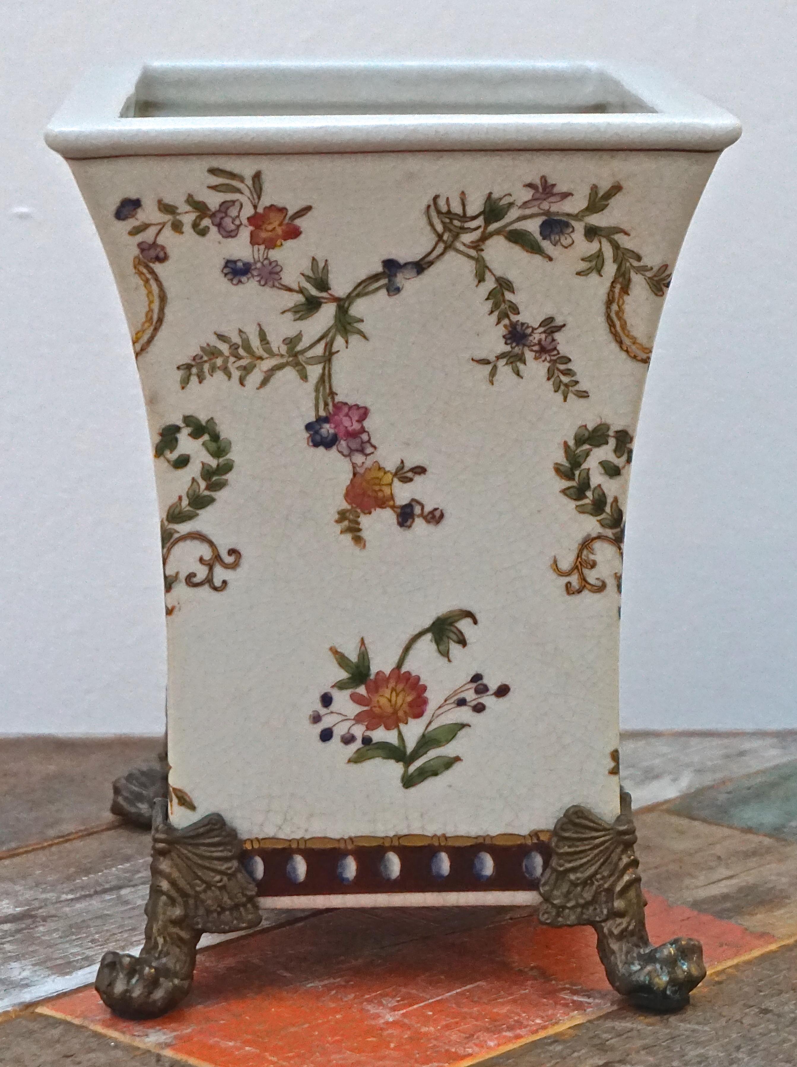 Beautiful porcelain hand painted vase in the French Renaissance style, by Chinese company Wong Lee. The vase has a crackle glazed finish, and bronze claw feet. The front and back have the same design, and the base is marked WL 1895. Wong Lee was