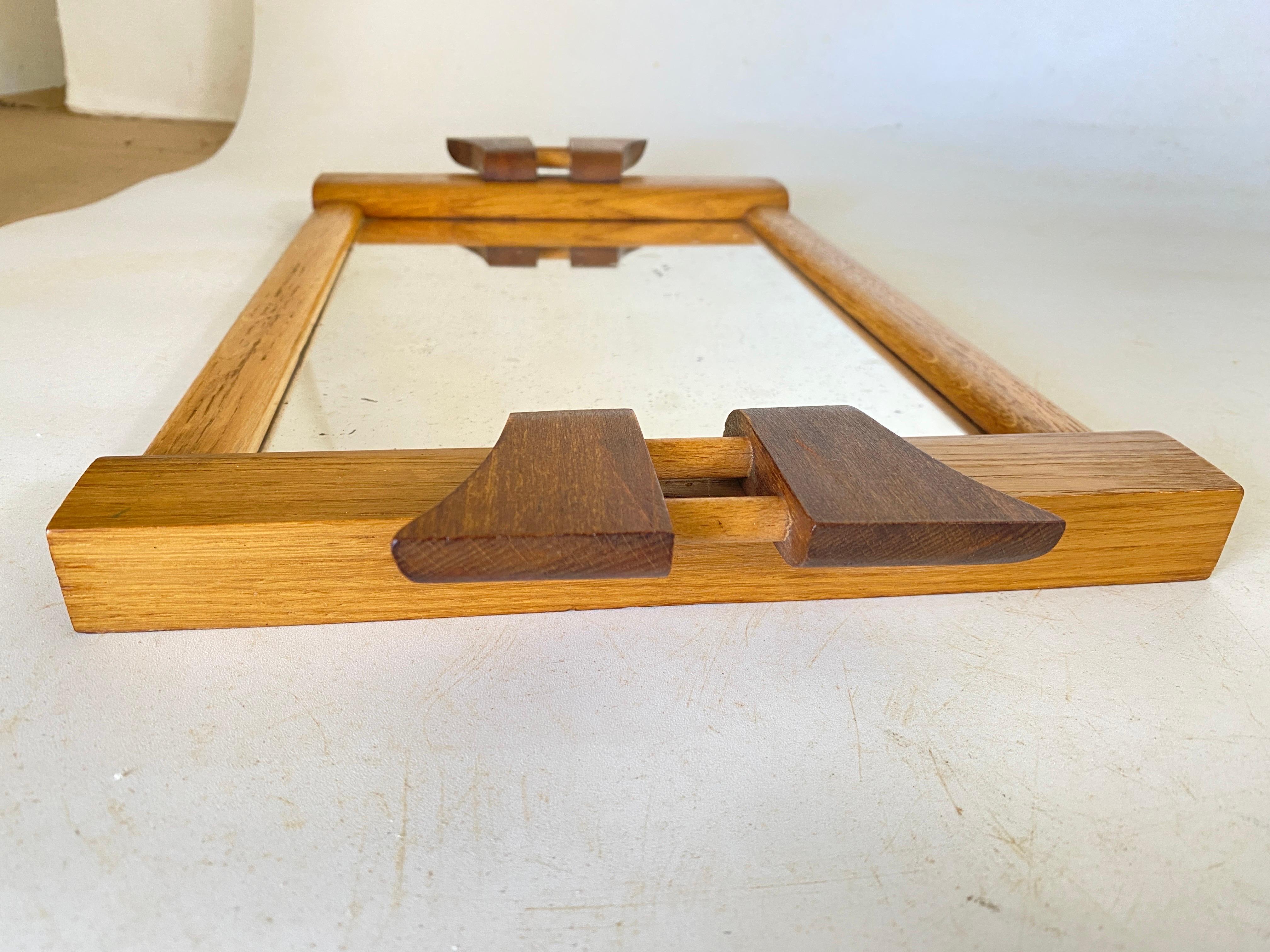 Authentic 1930s Art Deco tray from France. This tray is a medium size for everyday use. The top is in glass. The perimeter is made of wood. The condition is  good vintage, clean and usable.