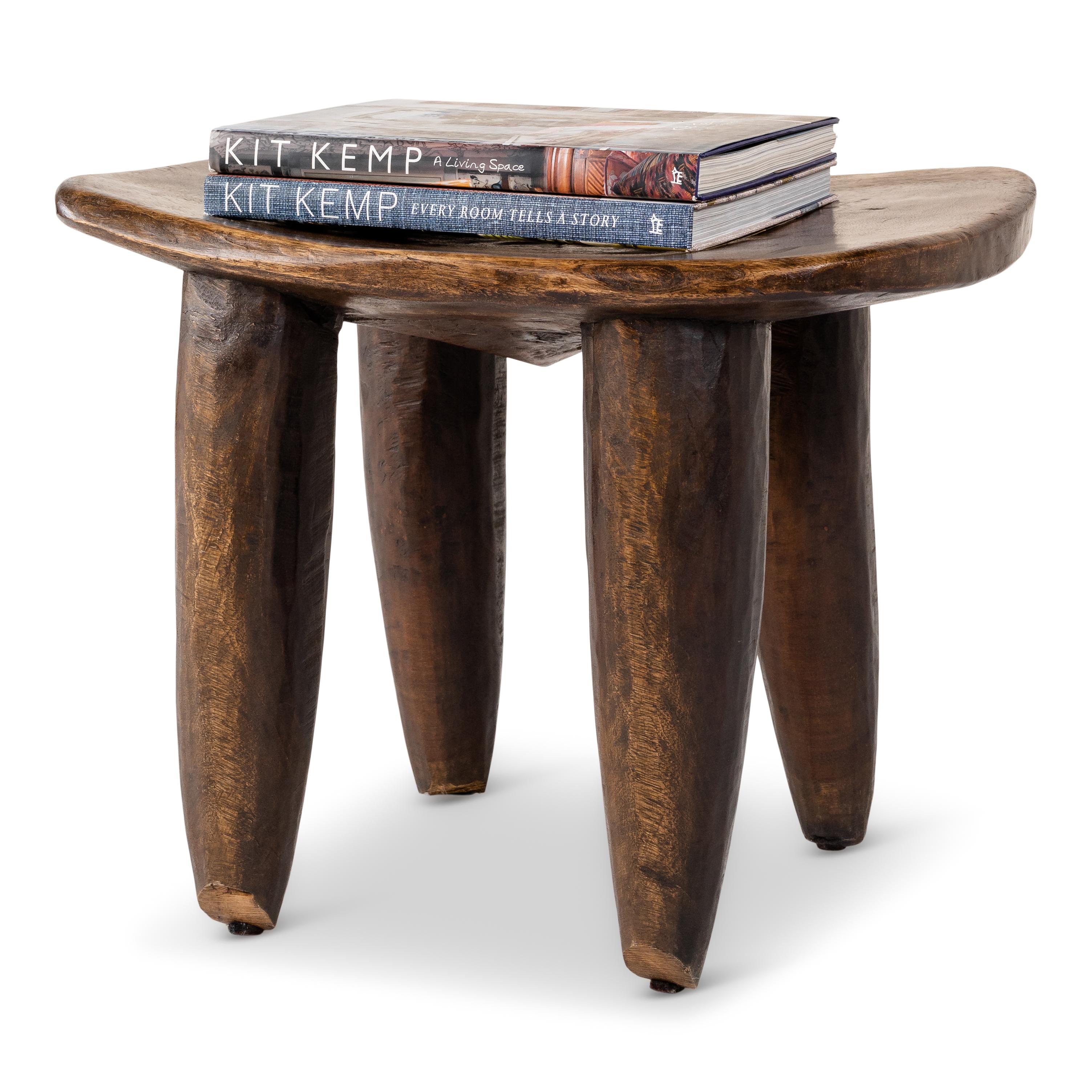 Hand carved African wood stools with tapered legs, curved seat, and a richly colored, smooth finish. 



  