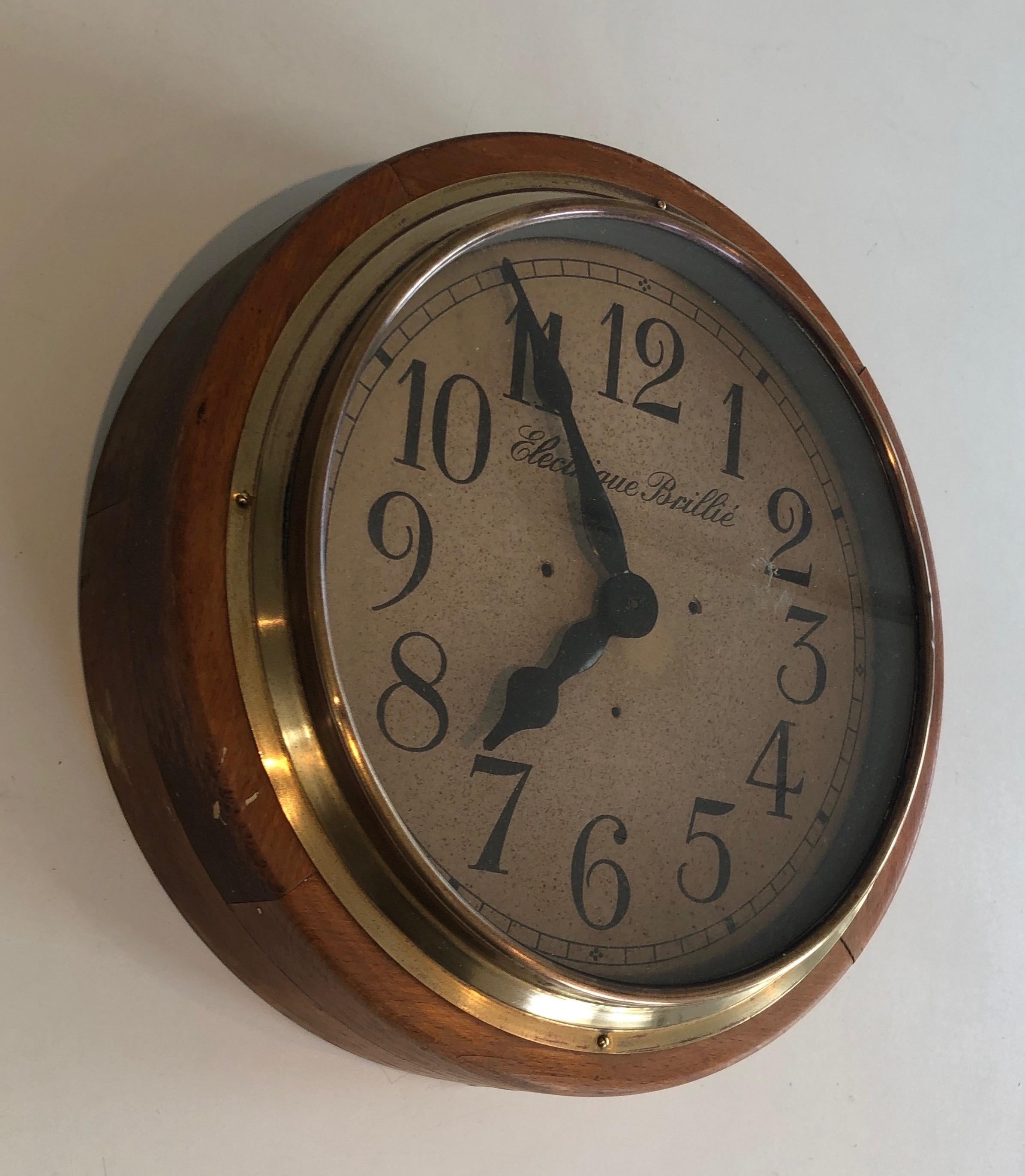 This nice decorative clock is made of wood, brass and metal. This is a model circa 1900 by famous French maker Brillé and the clock is signed Electrique Brillé.