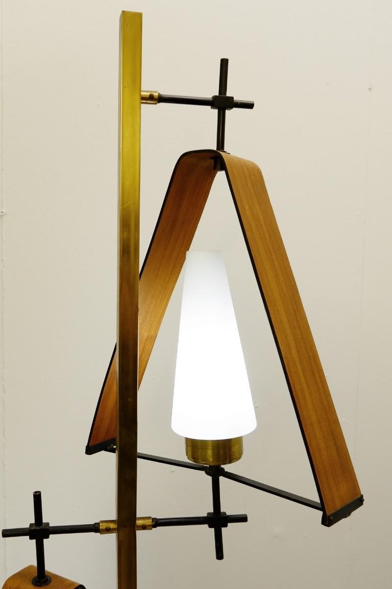 Wood and brass floor lamp.