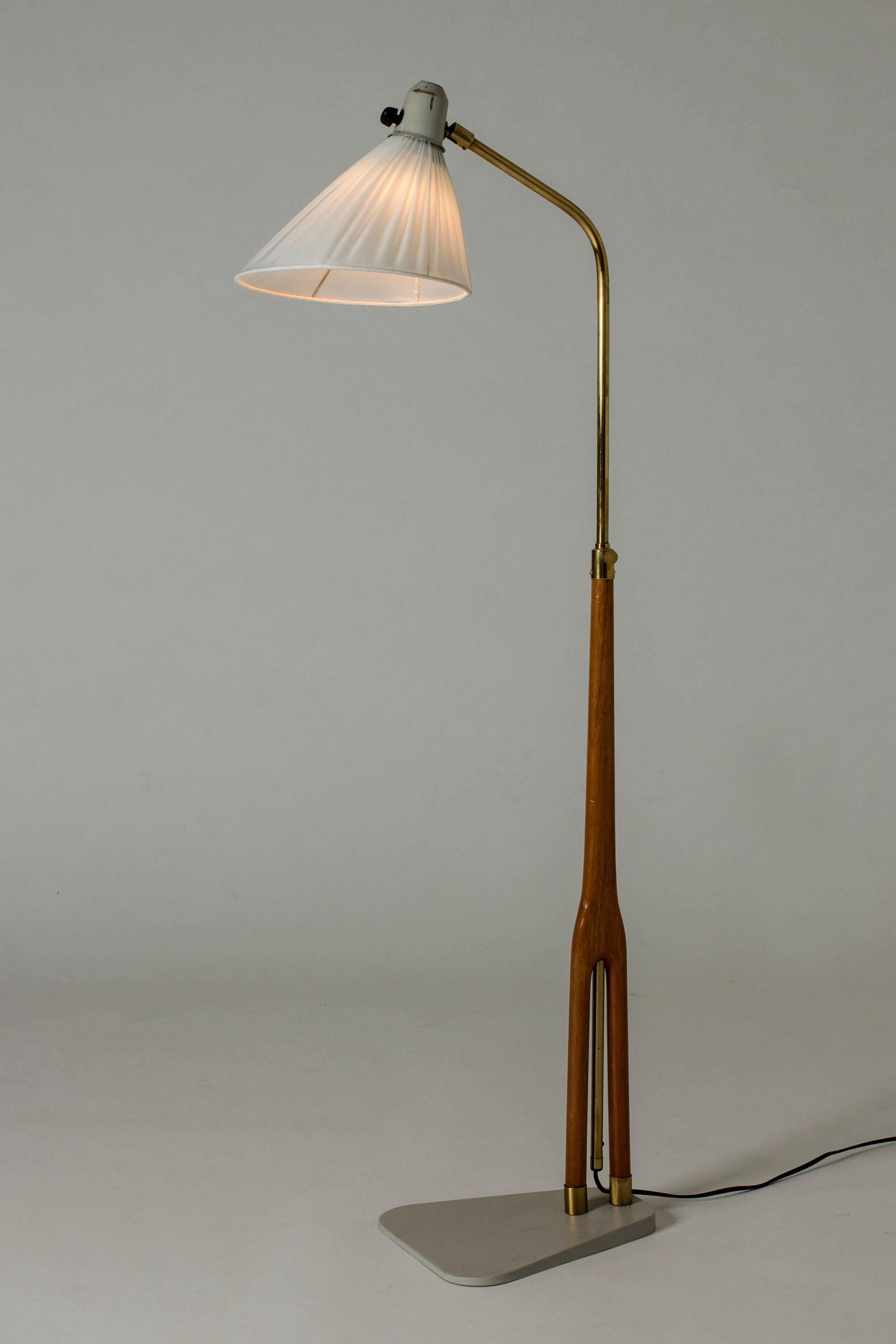 Cool floor lamp from ASEA, with a wide flat base in grey lacquered metal. Wood and brass handle. Graphic lines and nice combination of materials.