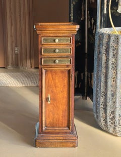 Wood and brass pedestal cabinet, late 19th century