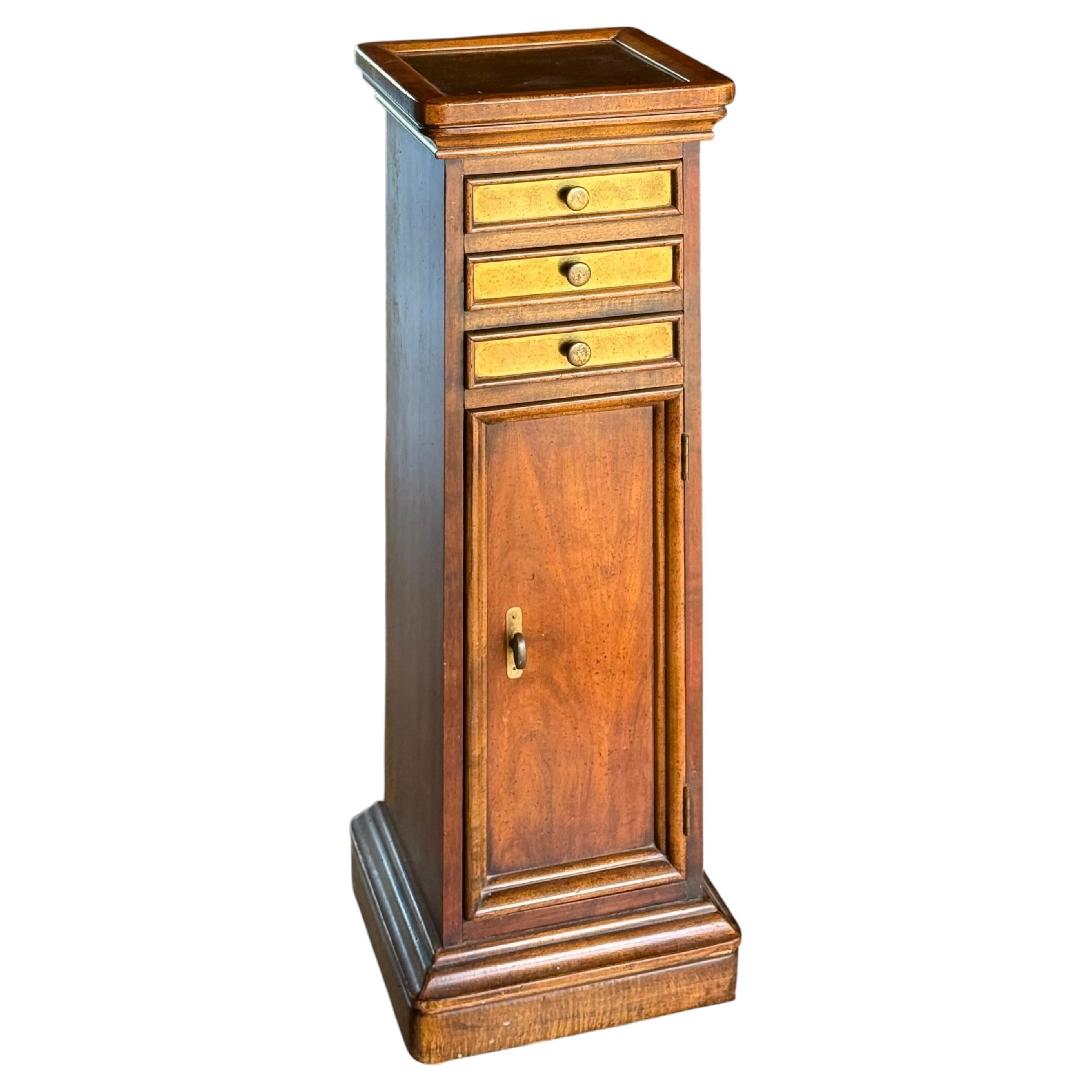 Wood and brass pedestal cabinet, late 19th century