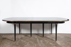 Wood and bronze dining room table with two extensions, Maison Jansen.