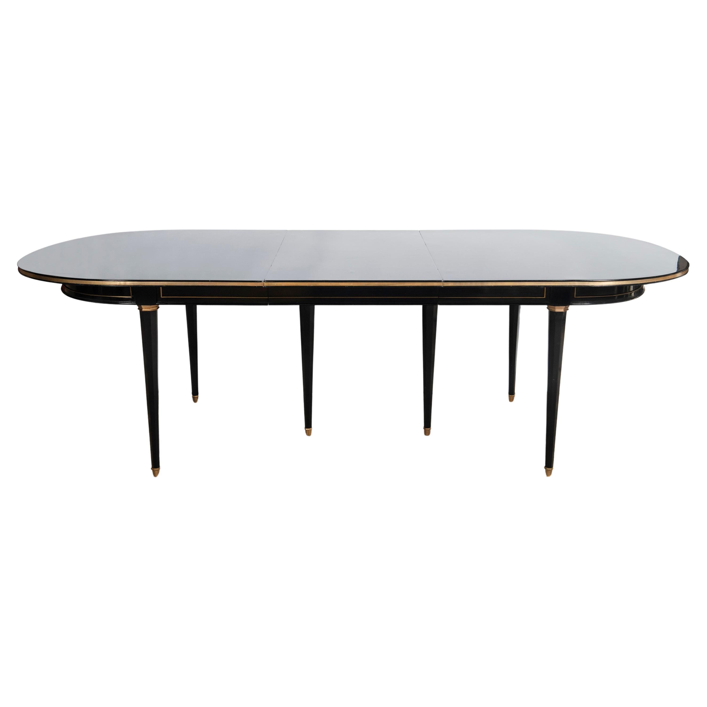 Wood and bronze dining room table with two extensions, Maison Jansen.