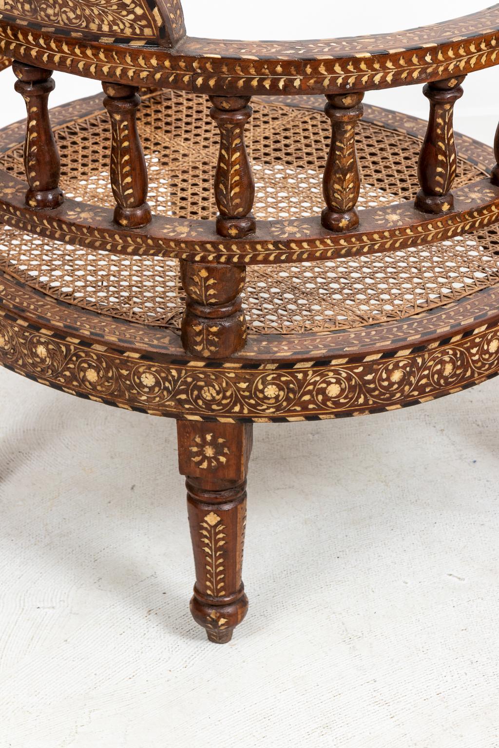 Wood and camel bone S-shaped tete on tete bench with inlaid camel bone detail and woven seats. Please note of wear consistent with age.