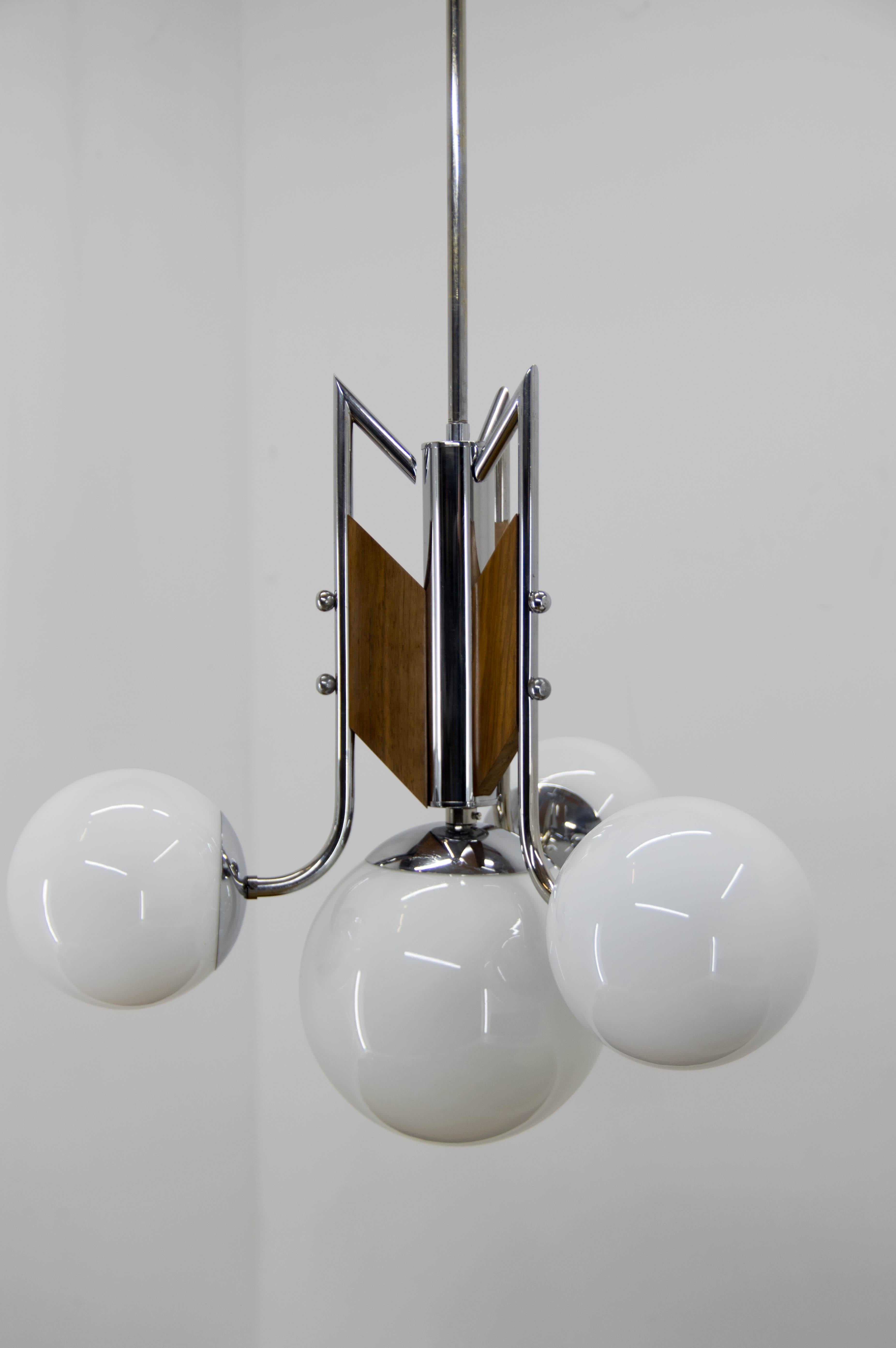 Unusual Functionalist chandelier made of chrome wood and opaline glass.
Restored - cleaned, polished, rewired:
two separate circuits: 3+1 E25-E27 bulbs
US wiring compatible.