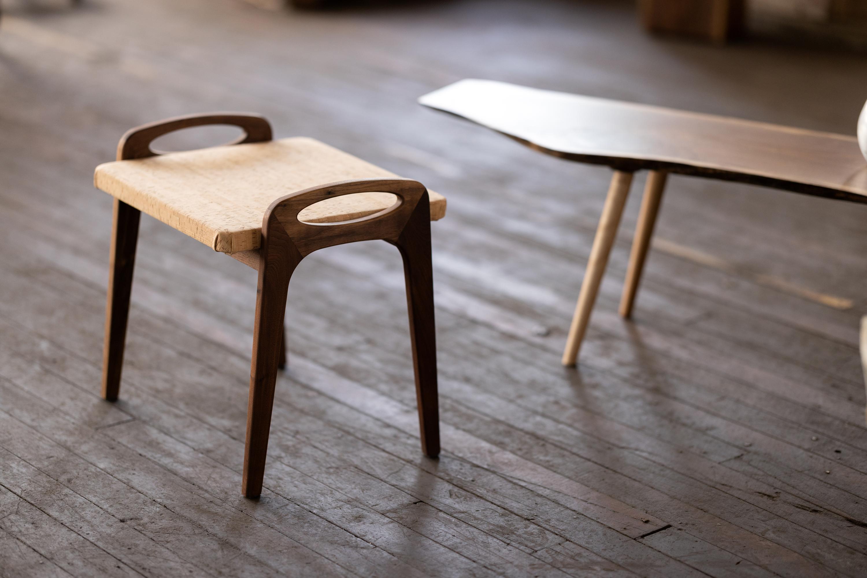 Organic forms and natural materials play a duet in this Mid-Century Modern inspired Suber stool. Upholstered in cork and shown here in walnut, our Suber stool can be used as additional seating in living rooms, bedrooms, or dining areas. The Suber