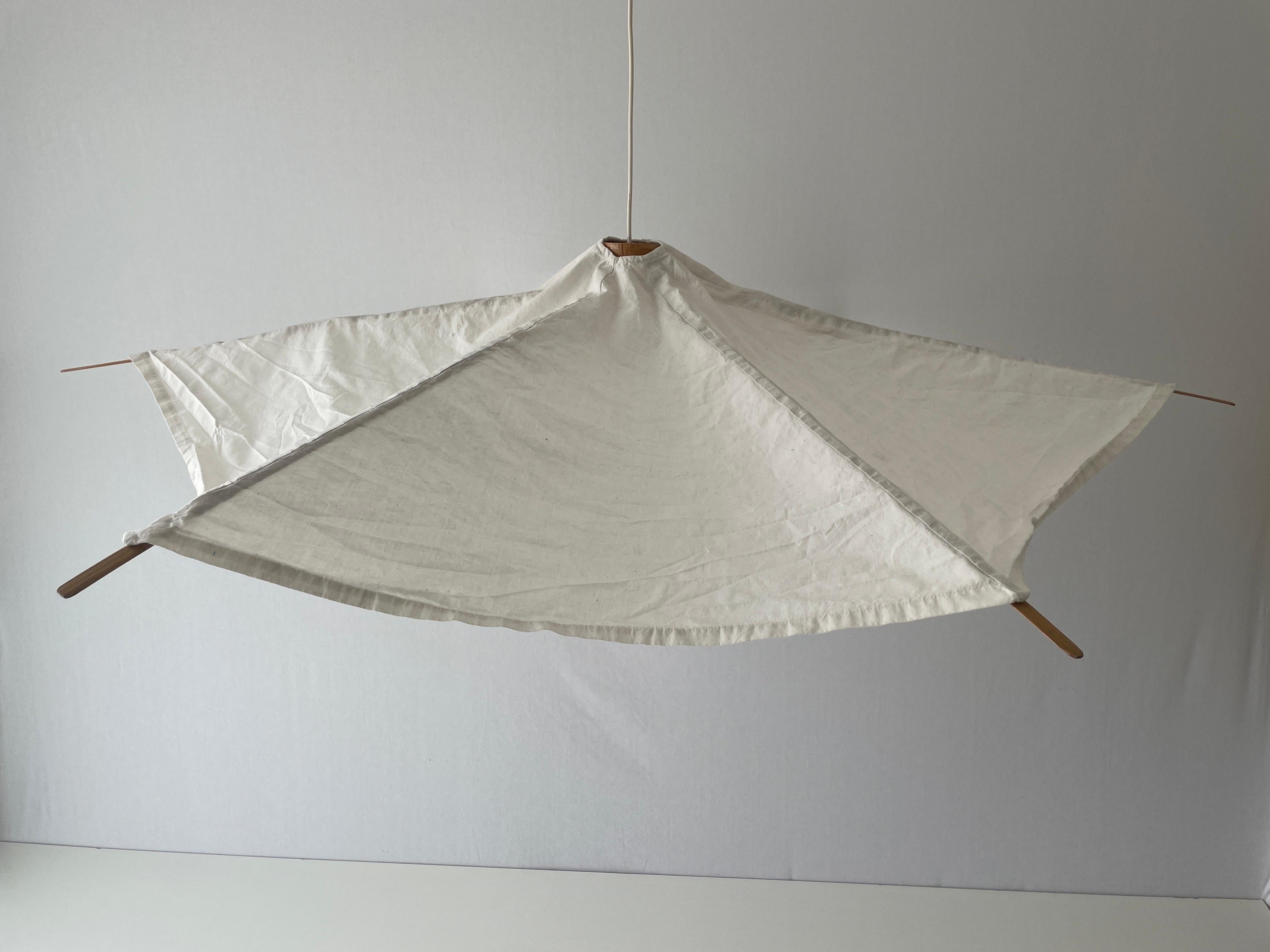 Wood and Fabric Tent Design Extralarge Pendant Lamp by Domus, 1980s, Italy

Minimalist and rare design. 

Lampshade is in good condition and clean. 
This lamp works with E27 light bulb. 
Max 100W Wired and suitable to use with 220V and 110V for all