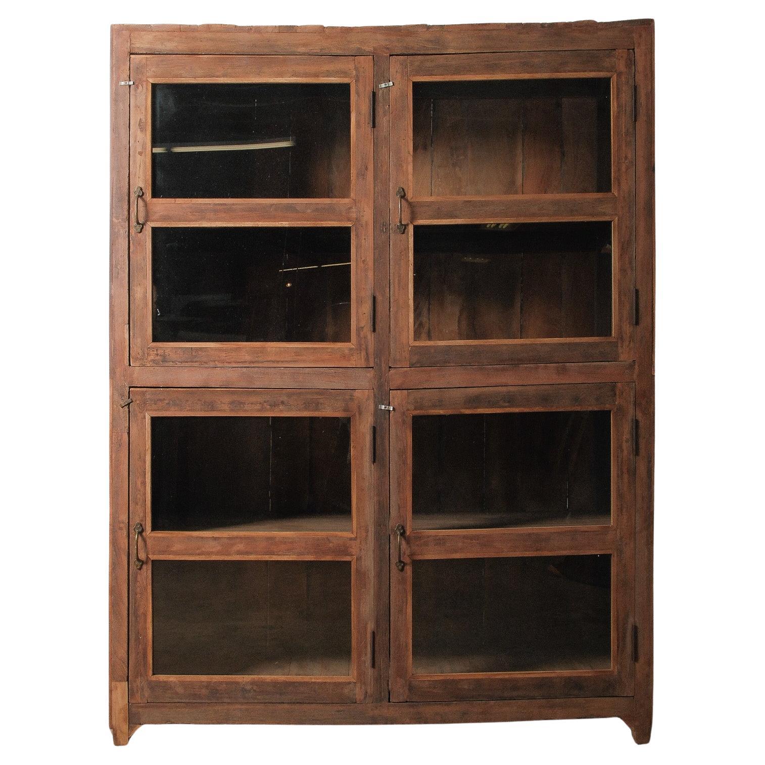Wood and Glass Four-Door Display Cabinet with Patinated Finish in vendita