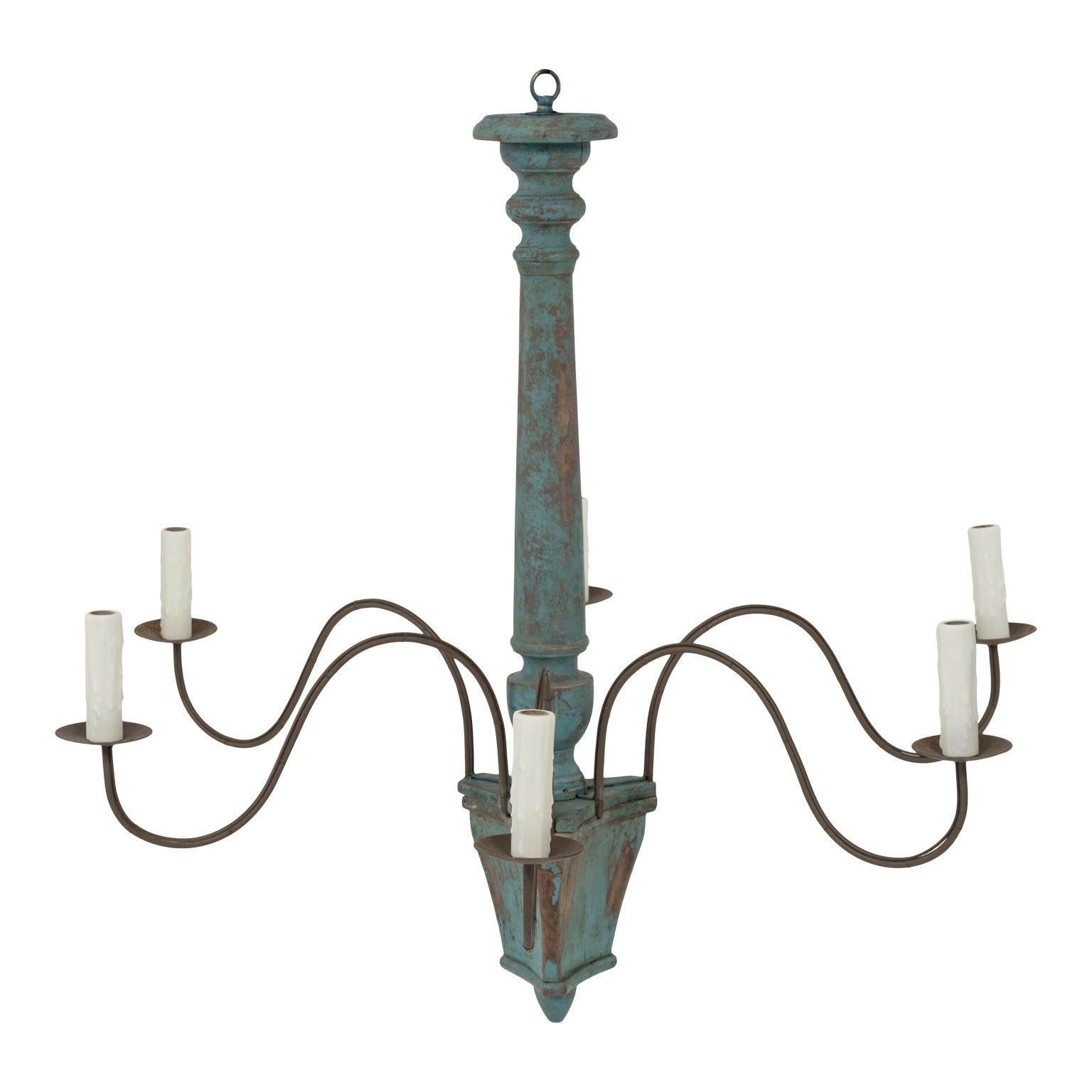 Wood and iron teal-painted Italian chandelier with six undulating arms radiating from turned and painted body. Newly-wired for use within the USA using UL listed parts. Accommodates candelabra-size bulbs. Includes additional chain and canopy (listed