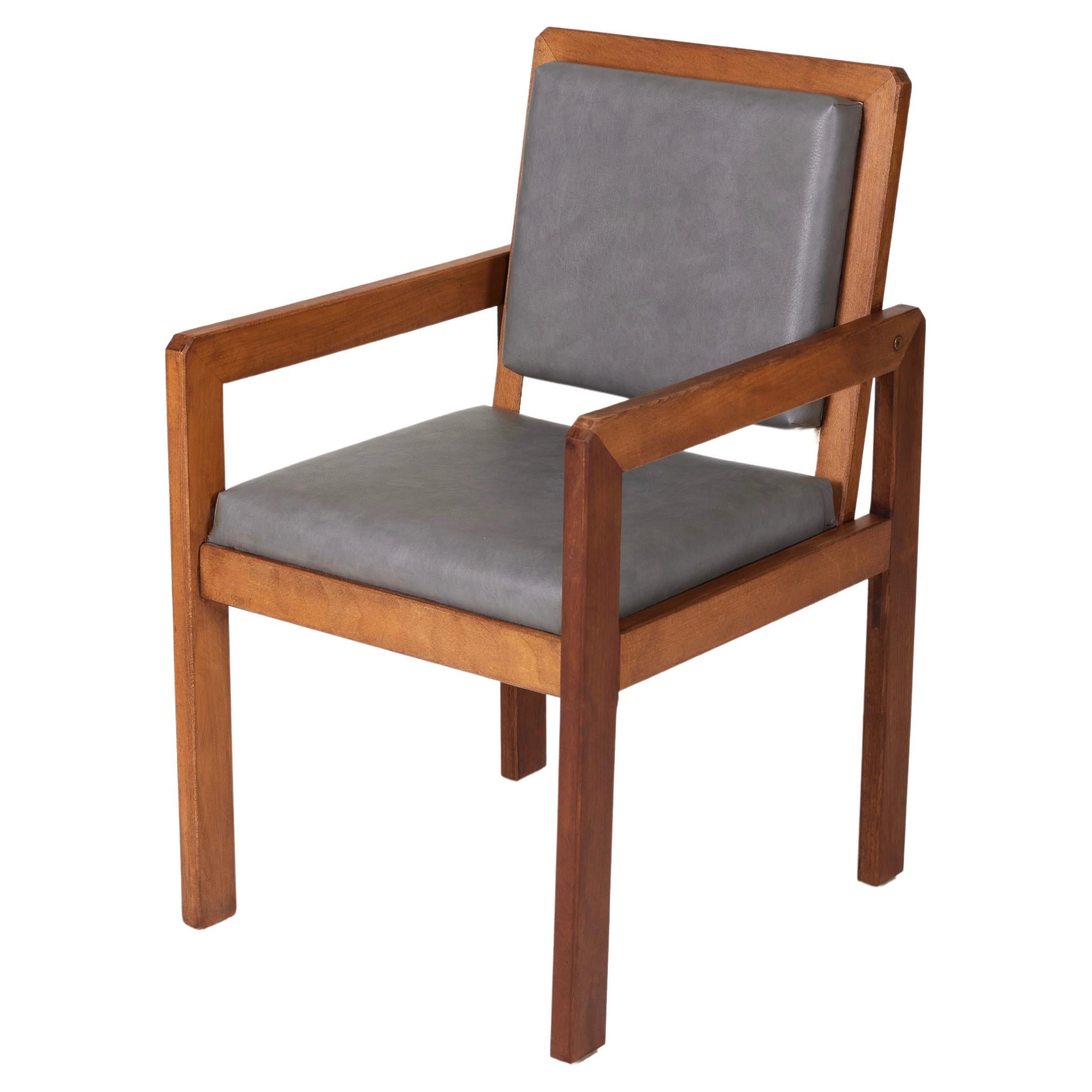 Wood and leather armchair by the french designer André Sornay For Sale