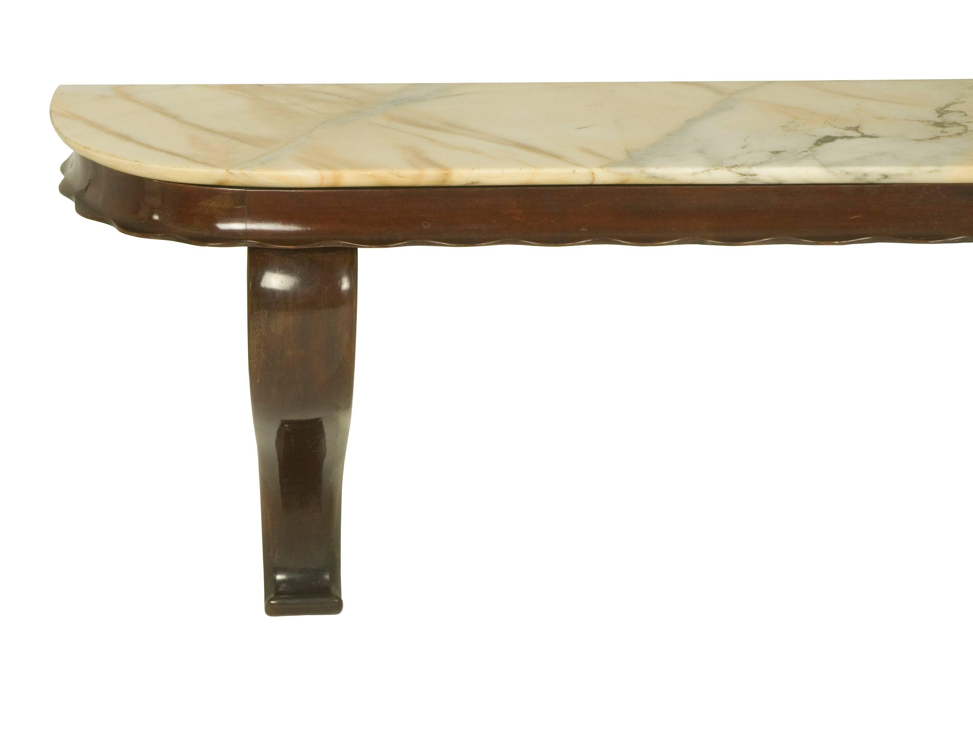 This fine console table was manufactured by Fratelli Barni Mobili d'Arte, a small manufacturer based in Seveso, near Milan, circa 1950s. It is made from lacquered wood and a marble top and it is wall-mounted. It remains in an overall very good