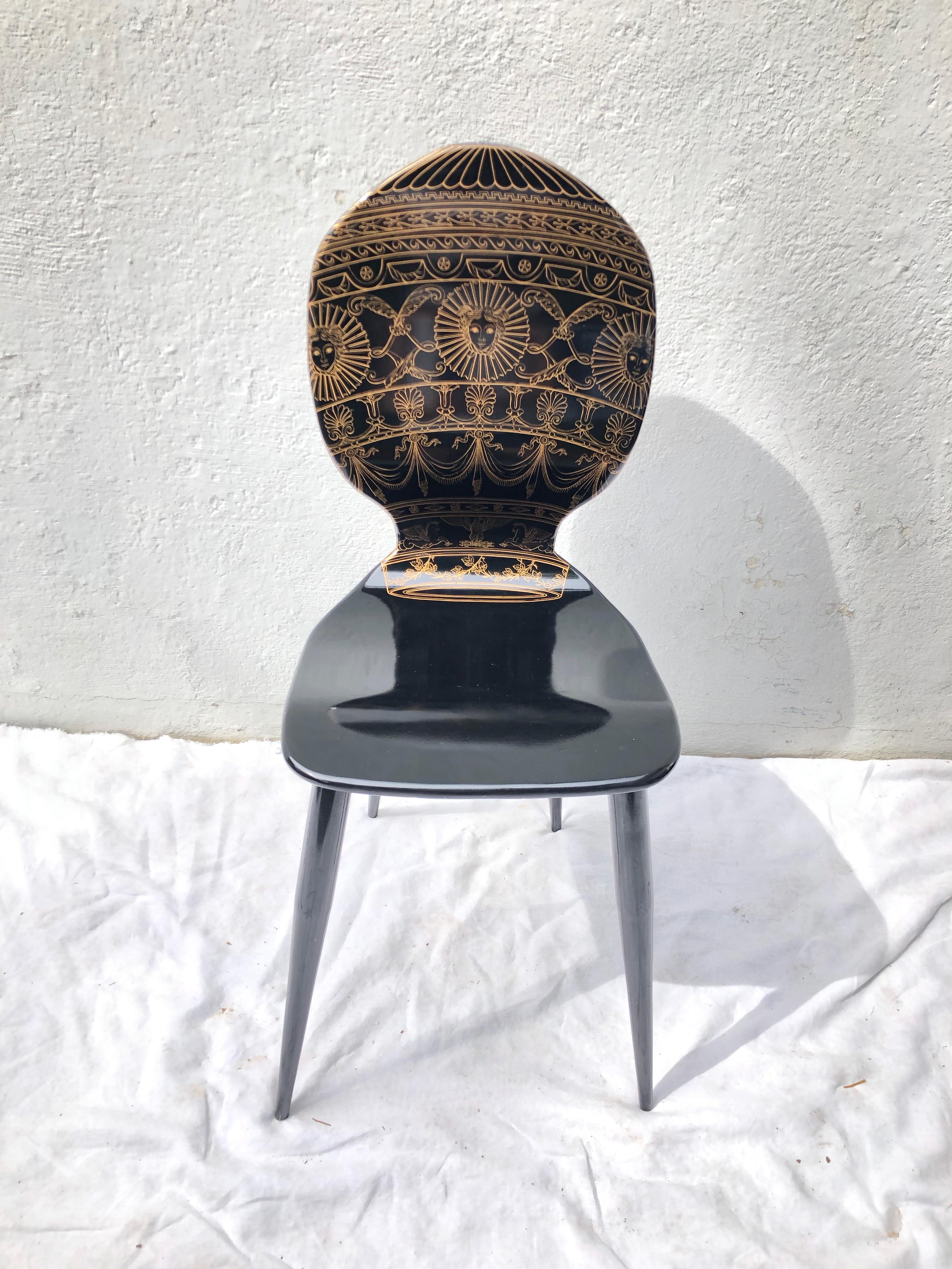 Piero Fornasetti lithographed wood and painted metal side chair.