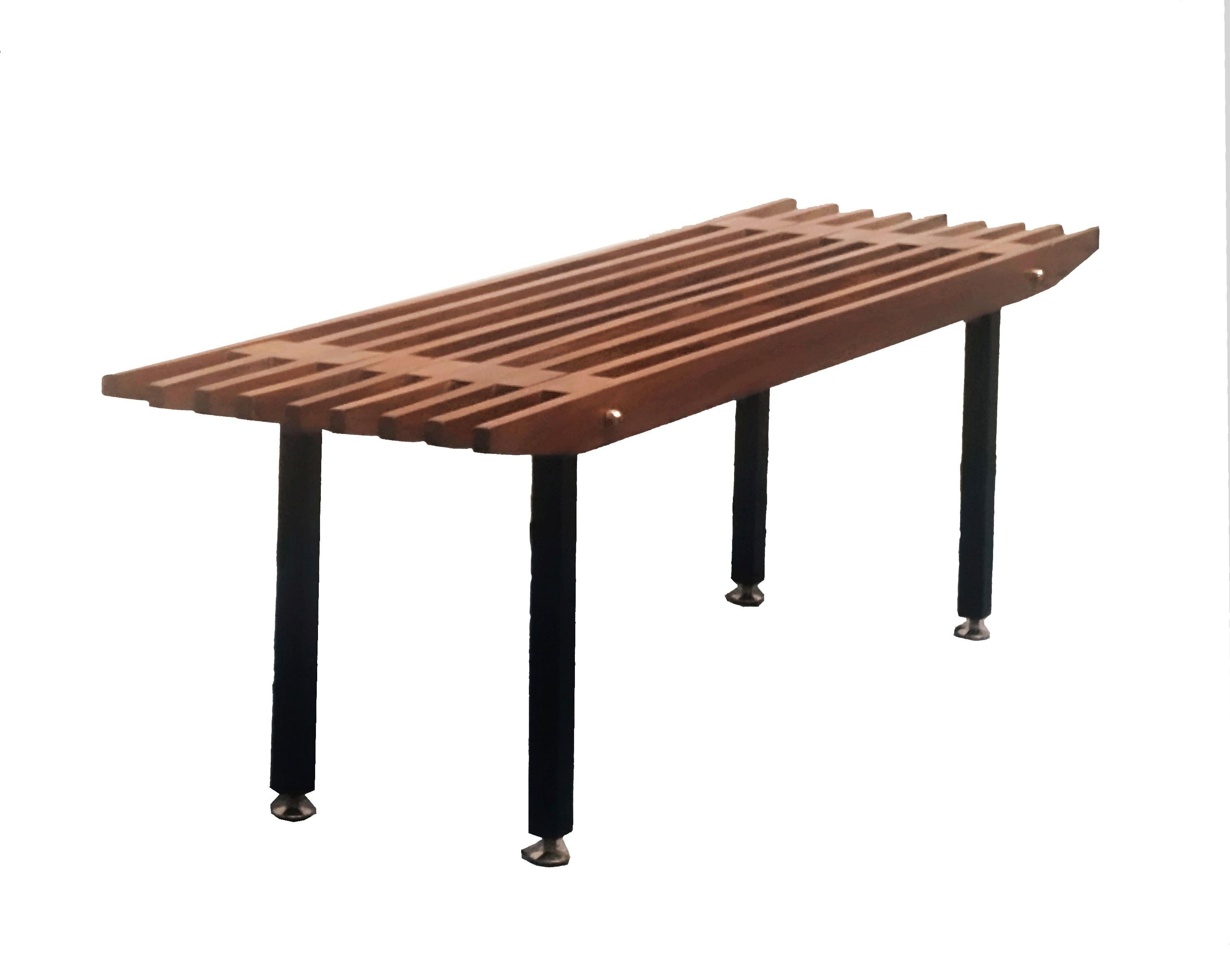 Teak wood bench, Italian production 1960s. The bench is made of teak strips, black metal frame with  brass feet.