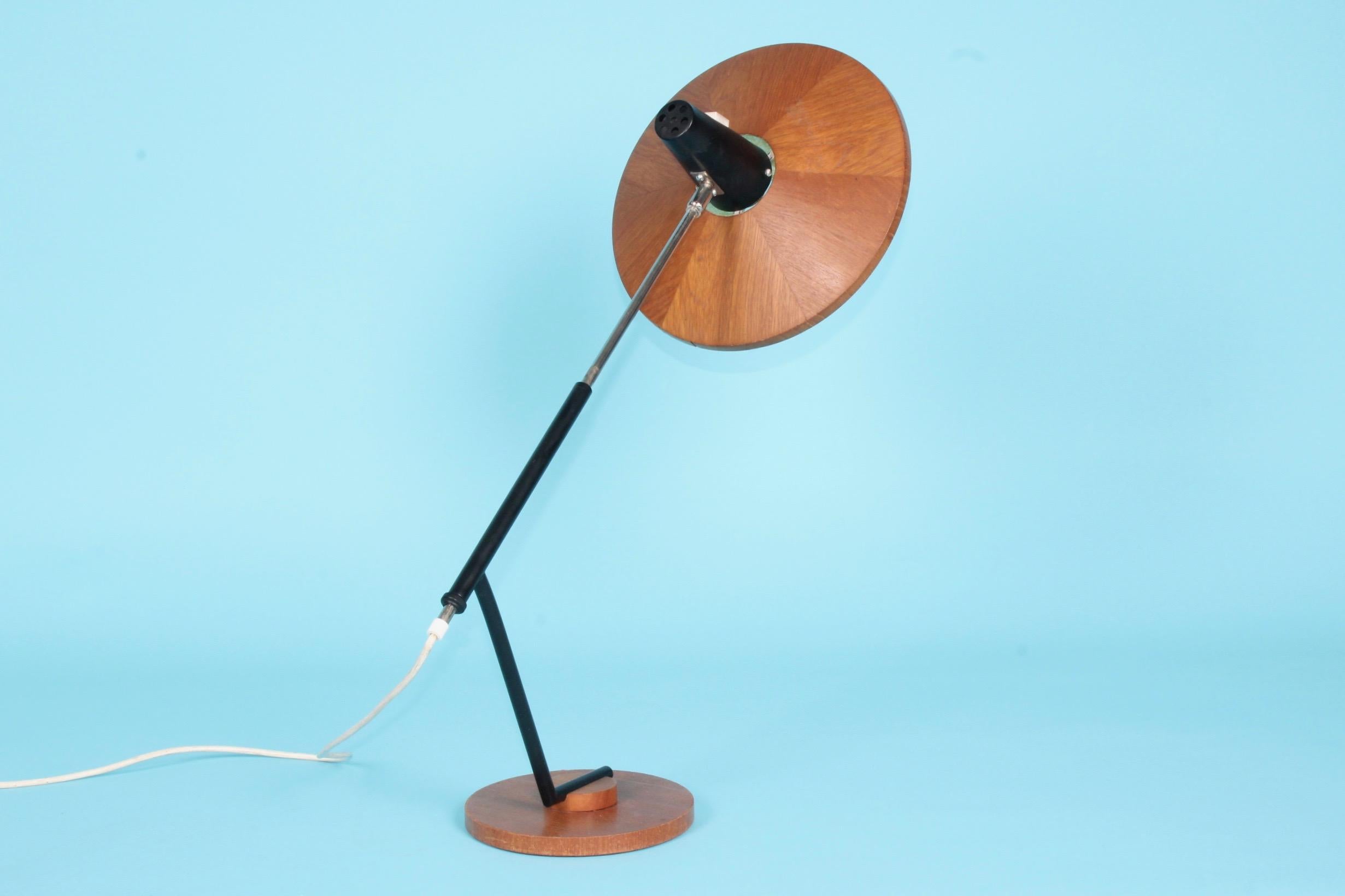 Wood and metal desk lamp, a small piece of wood is missing on the shade.