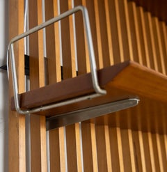 Wood and metal slatted wall bookcase with shelves and storage unit, 1960