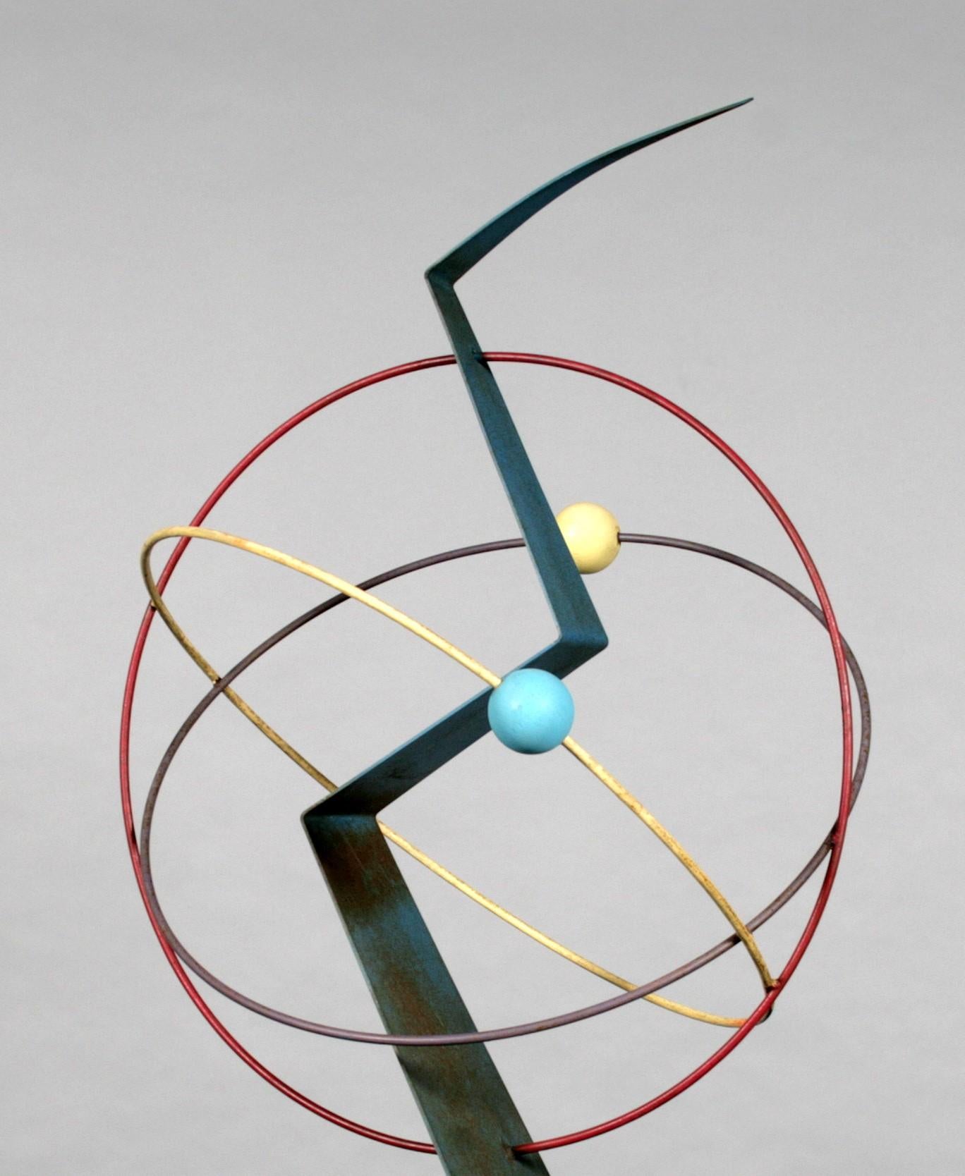Painted metal sculpture with painted wooden spheres by Curtis Jere. Signed and dated 1988. This is an unusual piece as unlike most of his work it  is painted colourfully and alo incorporates wood. The paintwork is lighly distressed which adds to its