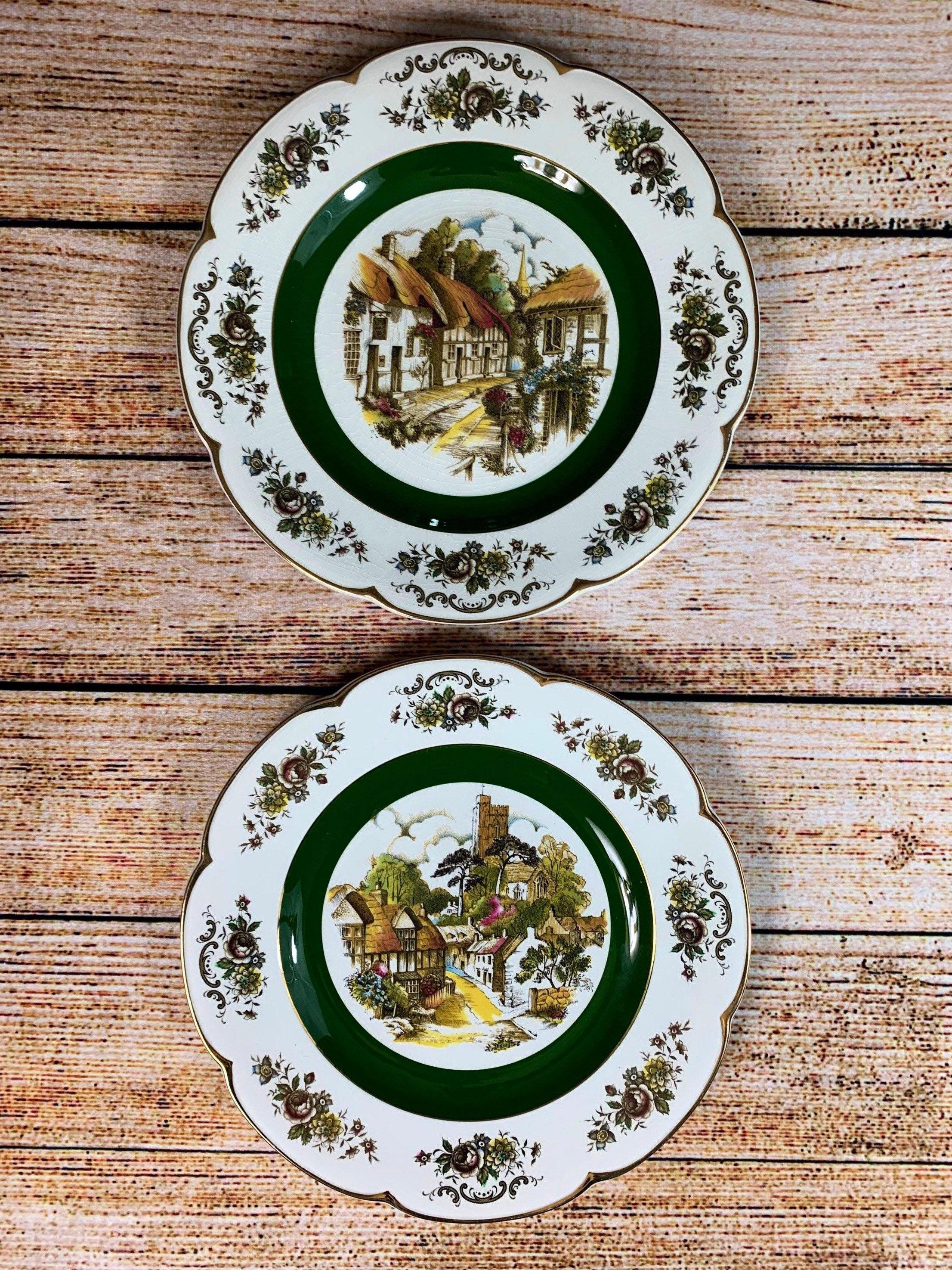 Alpine white ironstone Ascot service plates by Wood and Sons. Made in England, mid 20th century. 10.5 inch diameter. 

A beautiful pair to hang/display with rich autumn tones of green, gold, wheat, red, and orange. 

Food safe as well, perfect to