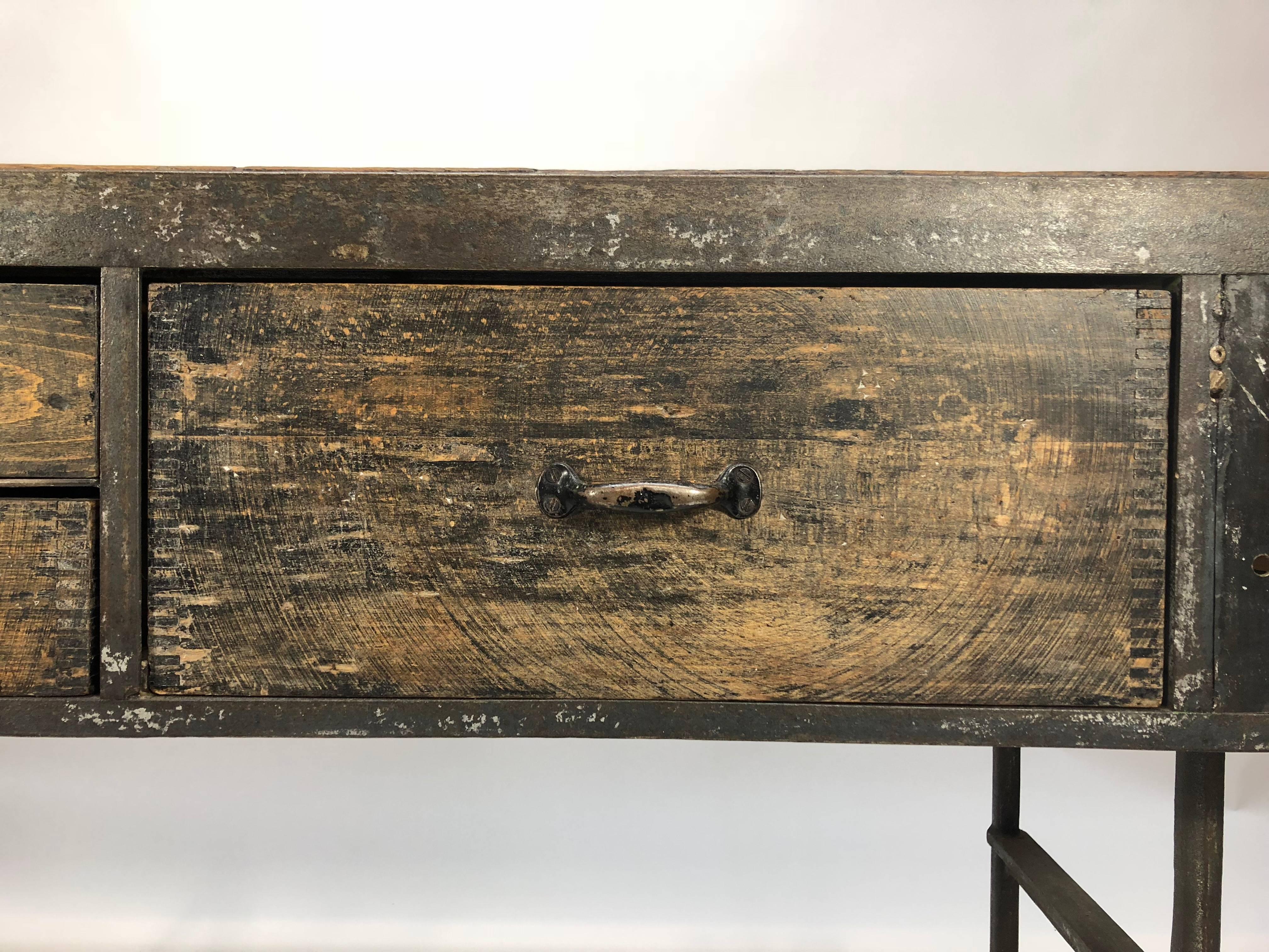 Wood and steel industrial console table with original patina and hardware.