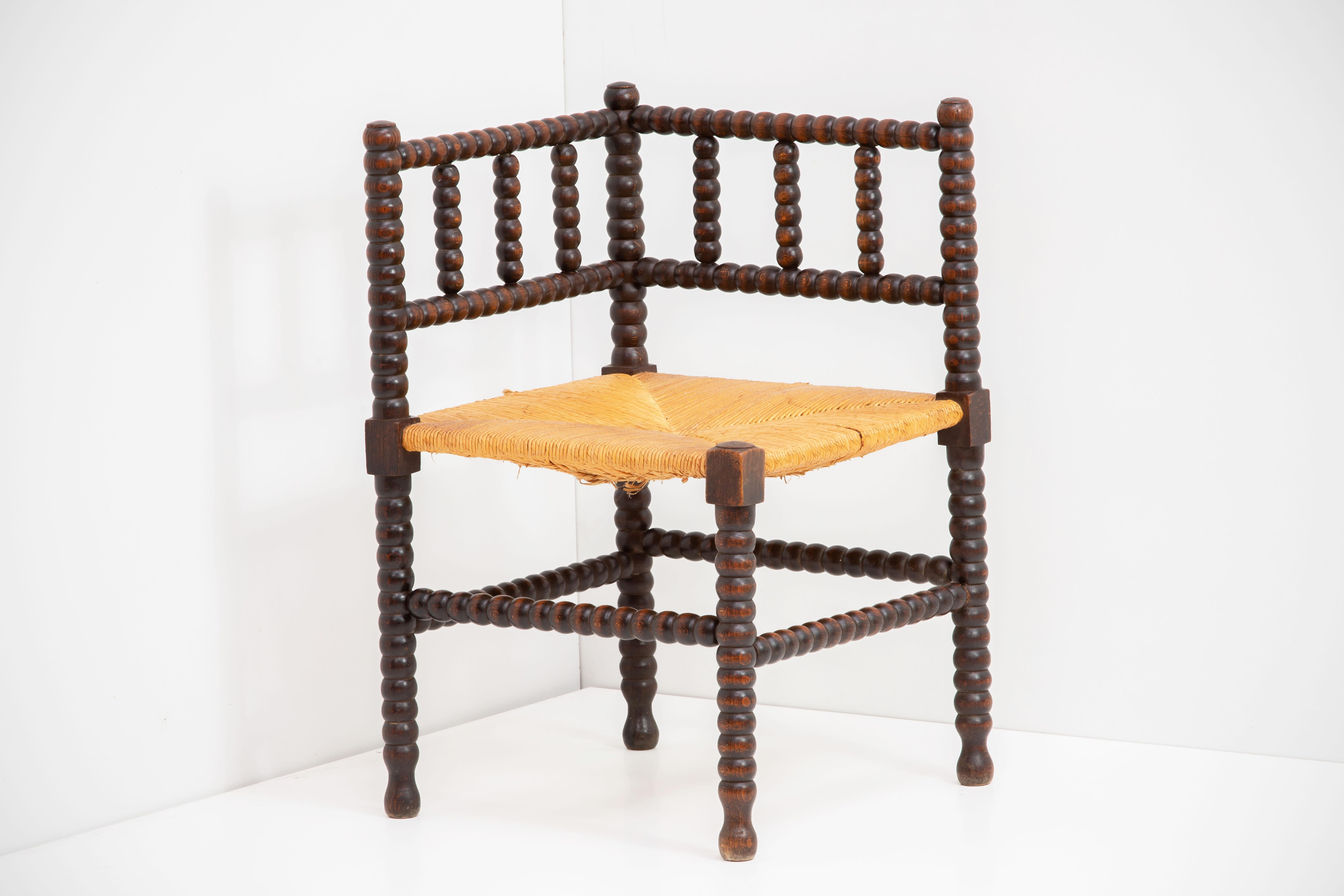 Wood and straw chair in the manner of Charles Dudouyt. 
A major figure in early 20th-century French design, Charles Dudouyt moved France’s design aesthetic from an elaborate classicism to a more modernist sensibility. His style found parallels with
