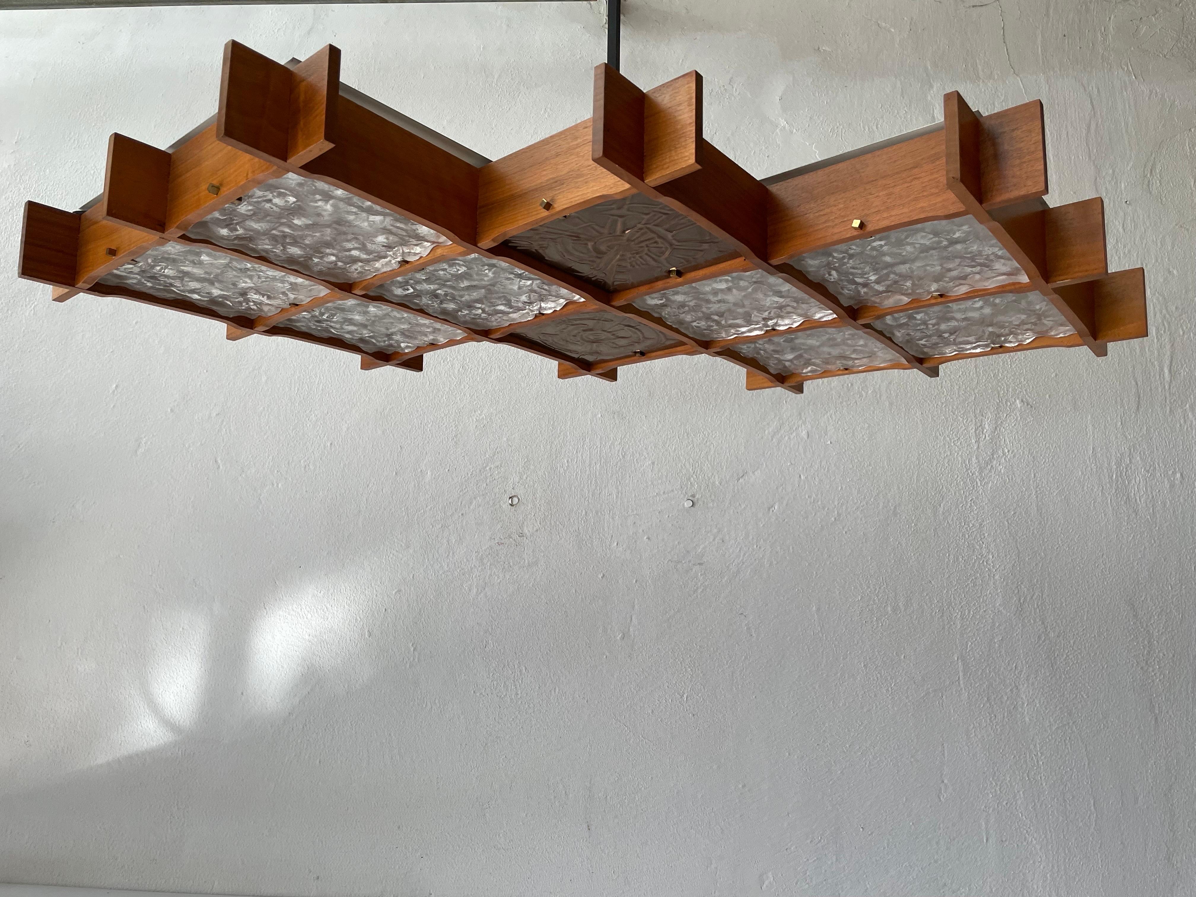 Wood and textured glass heavy ceiling lamp, 1960s, Germany

Lampshade is in good condition and very clean. 
This lamp works with 10 x E27 light bulb. 
Wired and suitable to use with 220V and 110V for all countries.

Measures: 

shade: 105 cm
