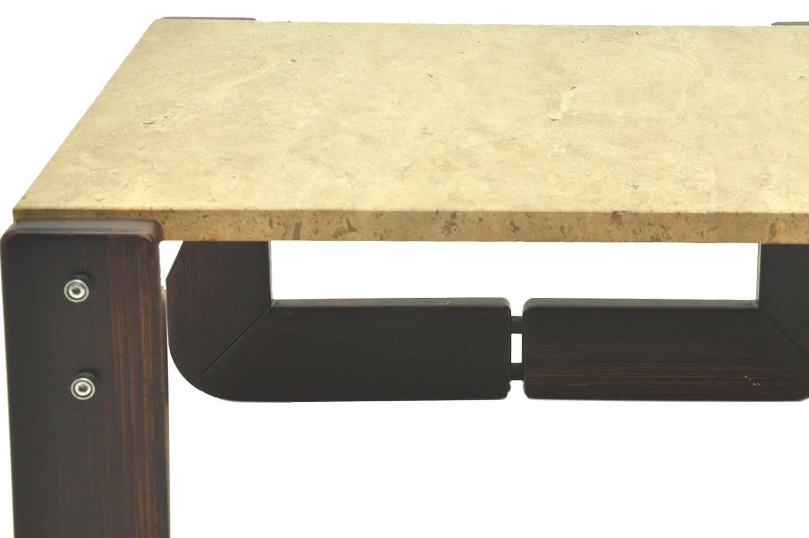This item is both a side table and a coffee table. The top is in travertine, and the structure in wood. It has been made in Italy in the 1960s, in the manner of tobia Scarpa.