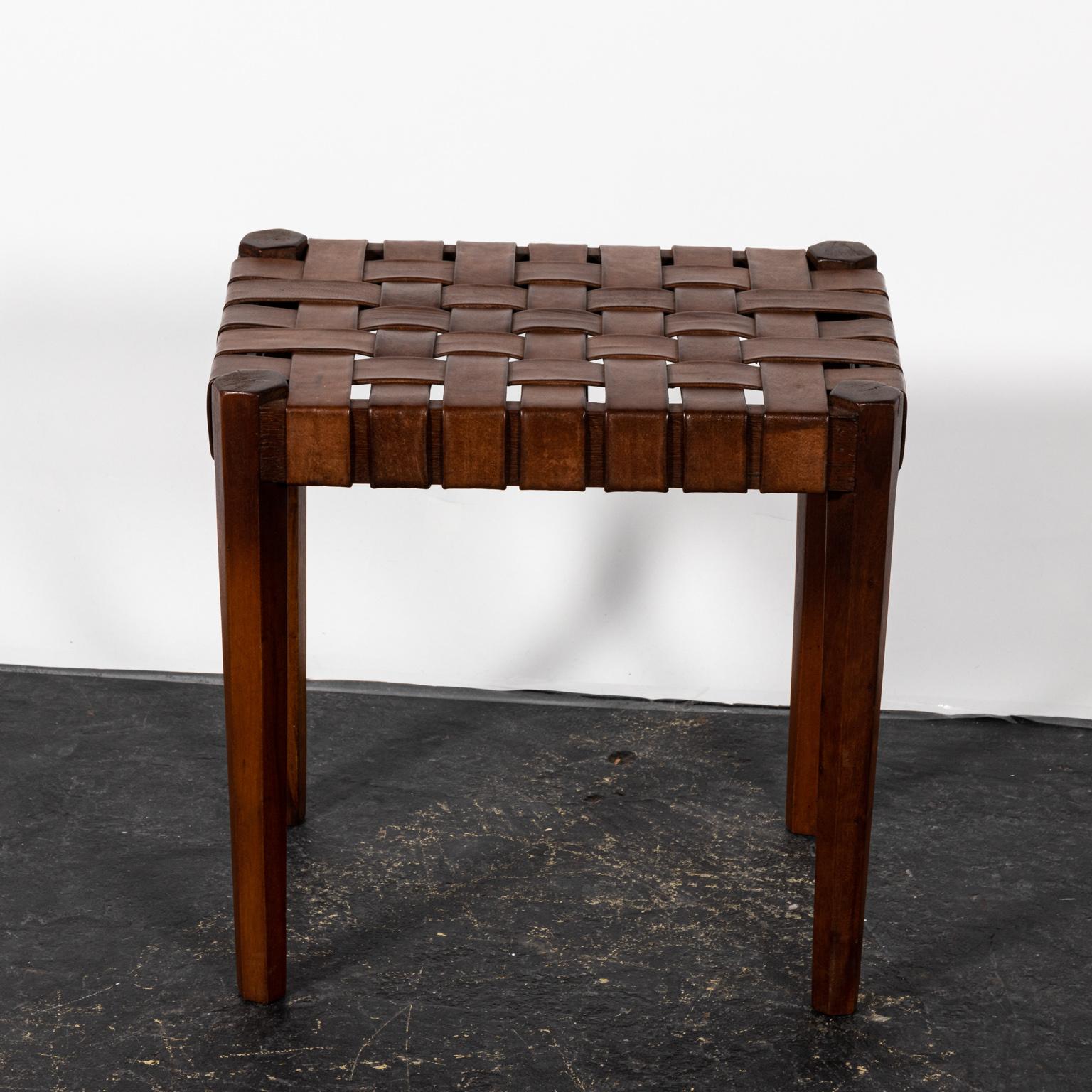 Woven leather stools on a wood frame. Please note of wear consistent with age including chips and minor finish loss.