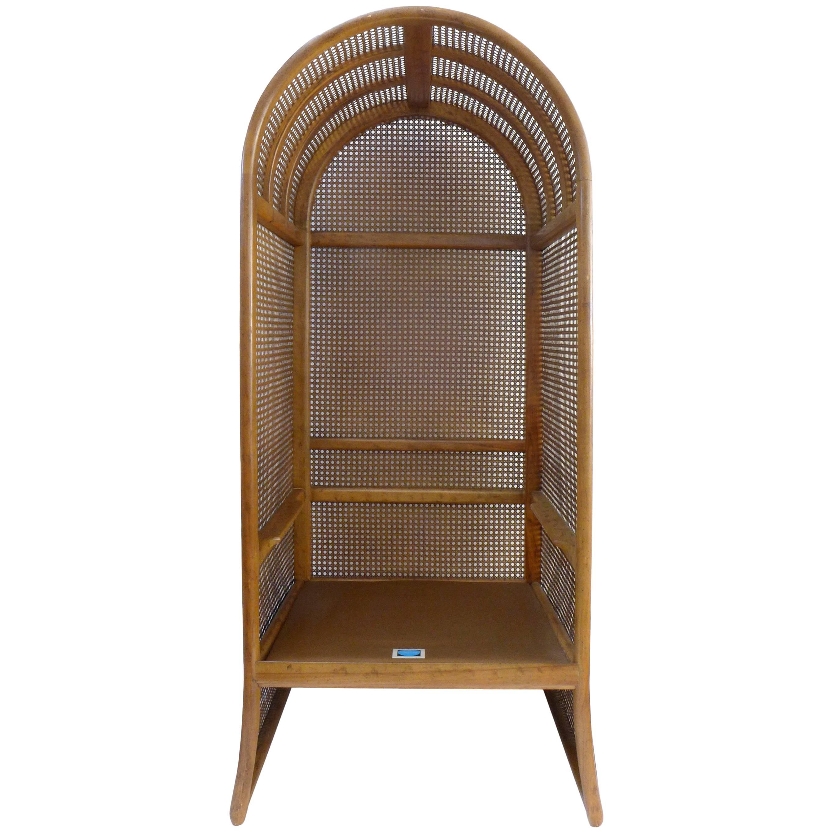 A monumental, wood and woven rattan canopy chair by Drexel. A fantastic, atrium-evoking, wood substructure fully clad in woven rattan. A sublimely inviting, one-seat sanctuary of impressive scale and proportion. Quality construction and materials,