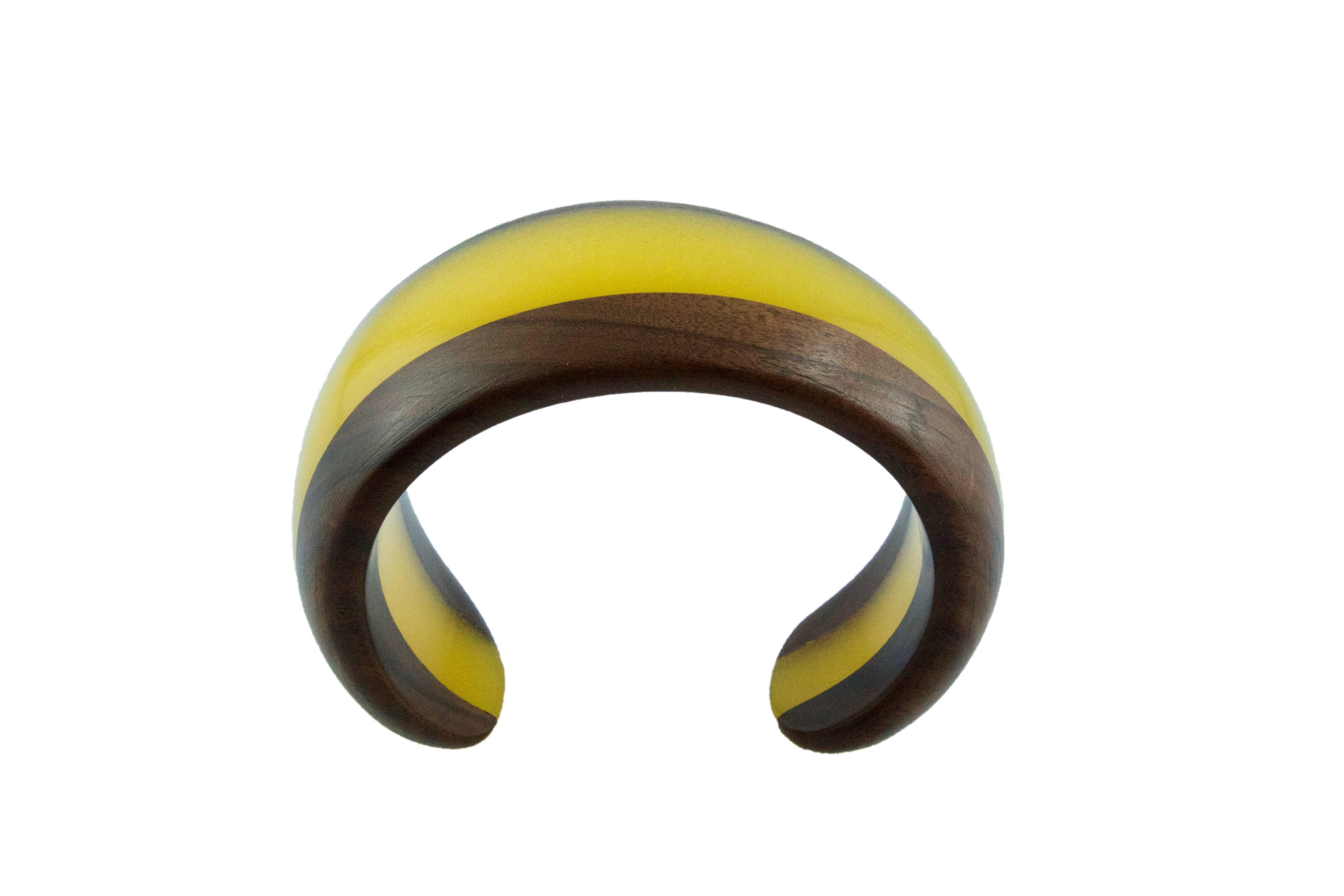 This modern and spectacular bracelet is totally hand carved made in wood and yellow methacrylate.