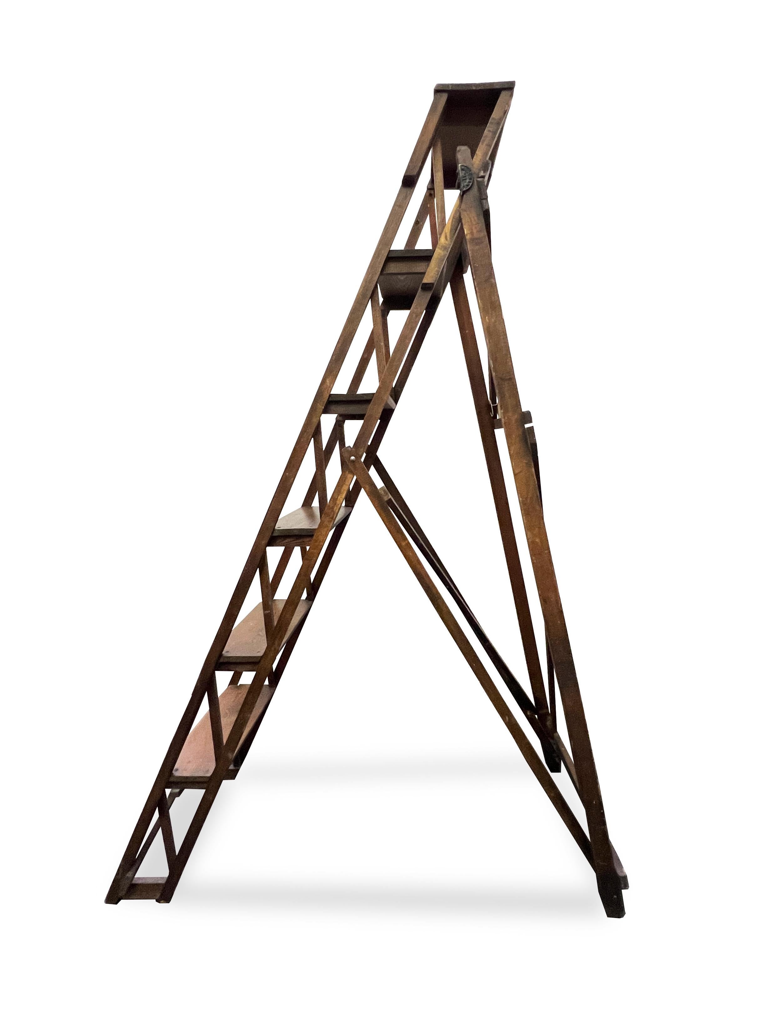 Wood architecturable foldable step ladder. Made in England. Circa 1970. Beautiful piece in great condition. Perfect addition to a home library. 

Dimensions Closed: W 20.125