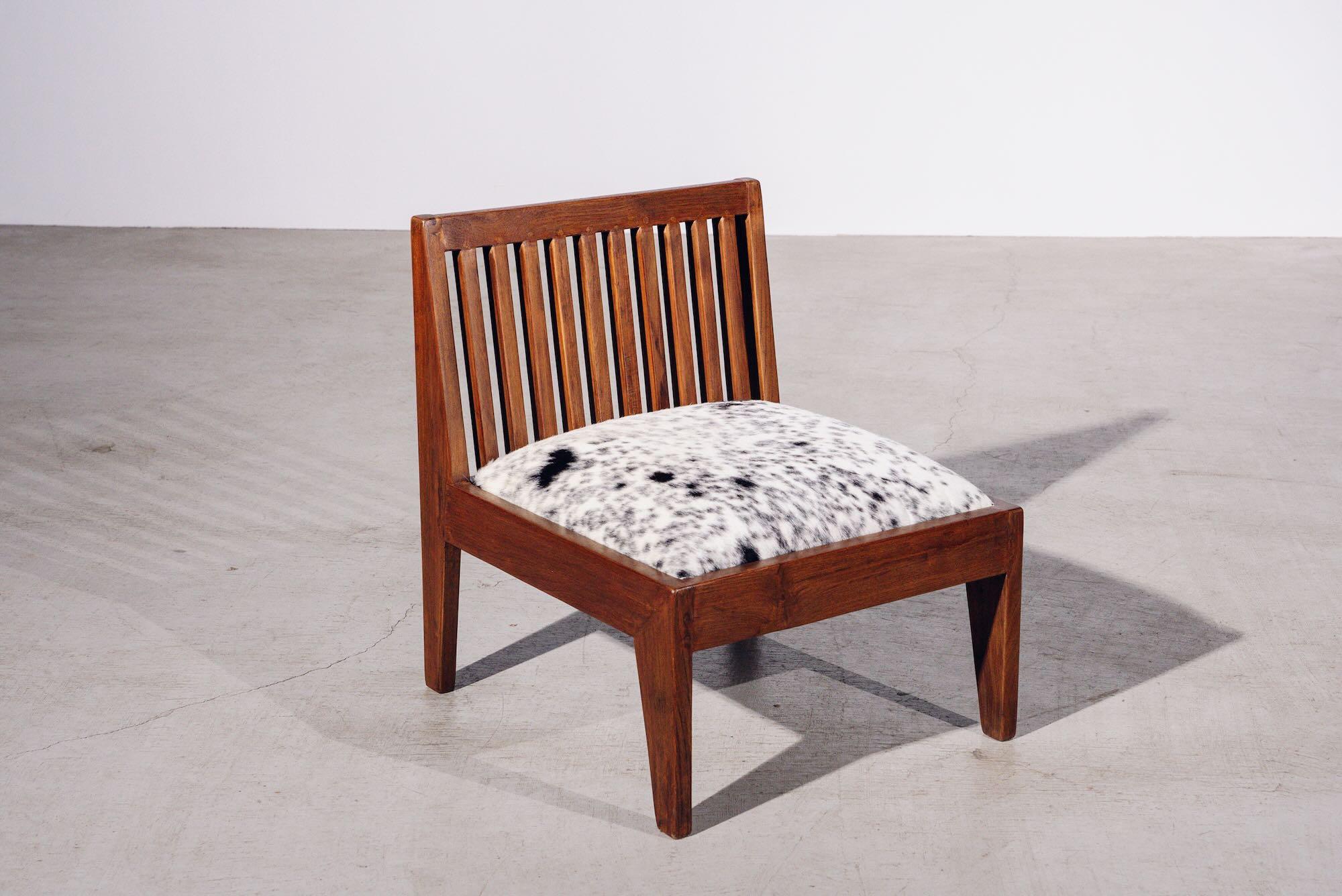An authentic mid-century piece from Pierre Jeanneret’s legendary Chandigarh commission. Teak frame with fabric upholstered seat.

Letter : P.U./CH/012 (Panjab University/ Chair N° 12)