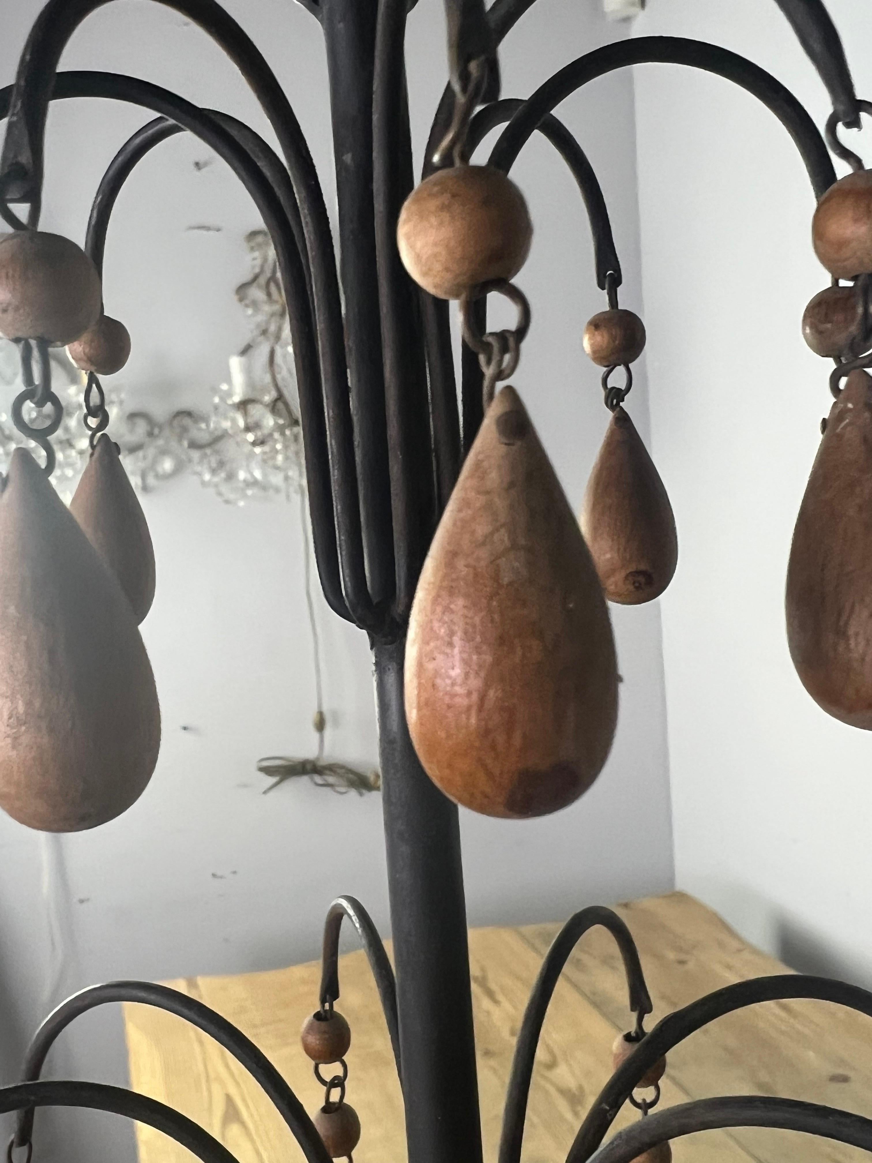 Wood Beaded Chandelier & Iron Chandelier, circa 1930 In Distressed Condition In Los Angeles, CA