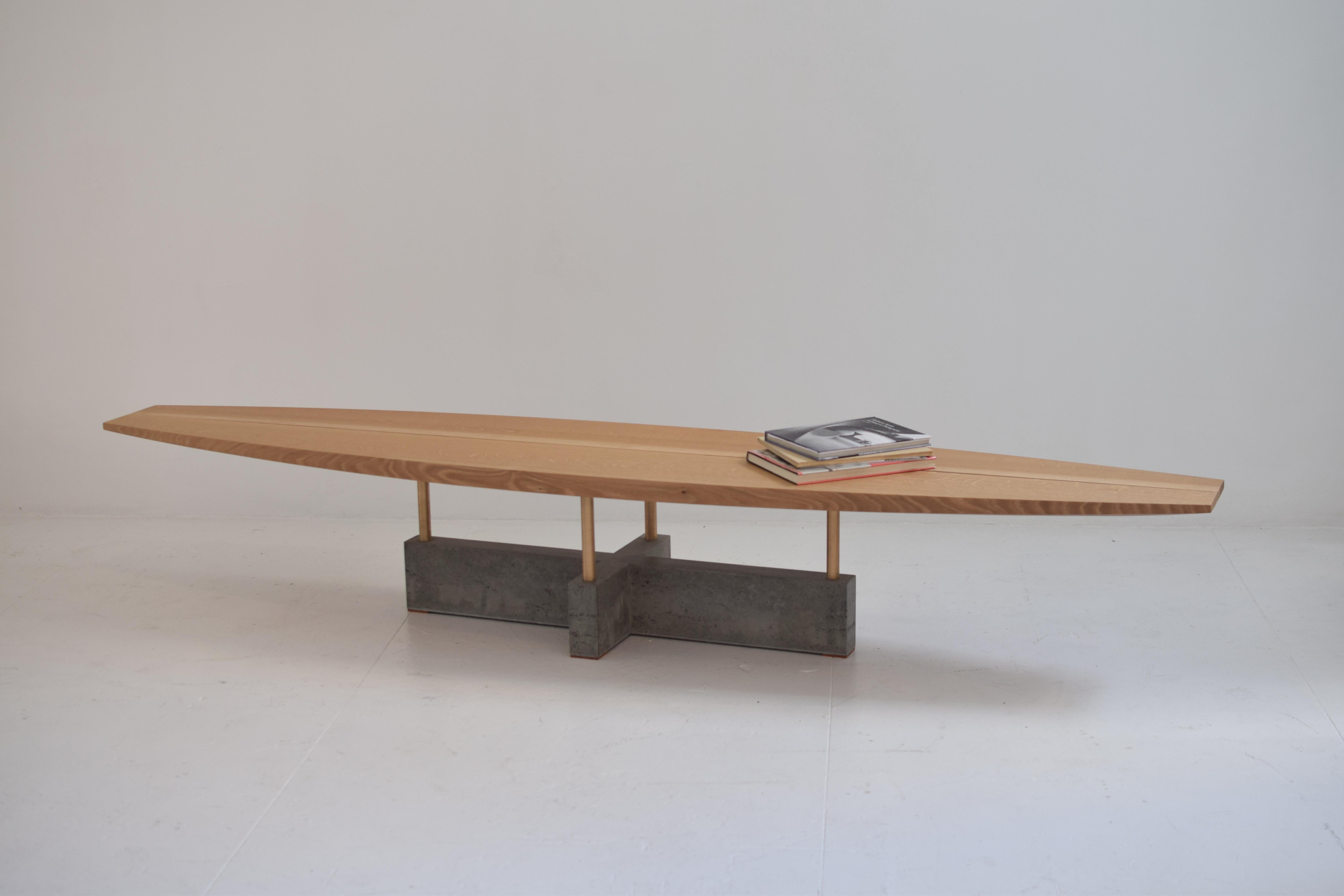 Cantilever bench/table

This bench/table brings together sculptural form and Minimalist aesthetic. The carved wooden bench paired with the smooth geometric base is the center of attention in any room. The hand-shaped surfboard top is two wooden