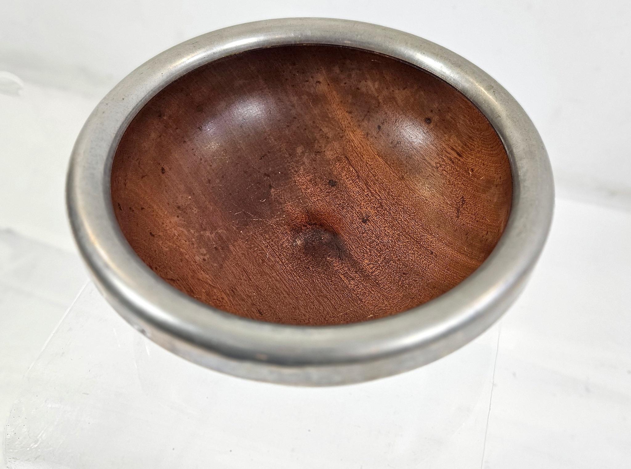 A teak bowl made by the DMK - Daniela Mola & Ingo Knuth manufacture from the 1980s. The large bowl serves as a fruit bowl or for a centerpiece. Their workmanship under all handmade and hand-turned from a single block of wood. In each product we find