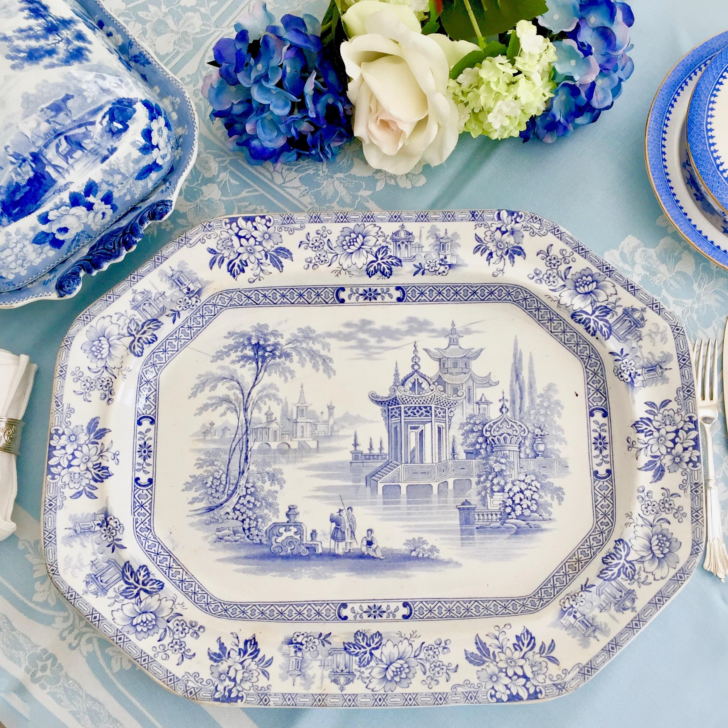 This is a beautiful and well made meat platter made by Wood & Brownfield (later called Brownfield) between 1841 and 1850, which was the Victorian era. It is made of pottery, and has a blue on white transfer print of the 