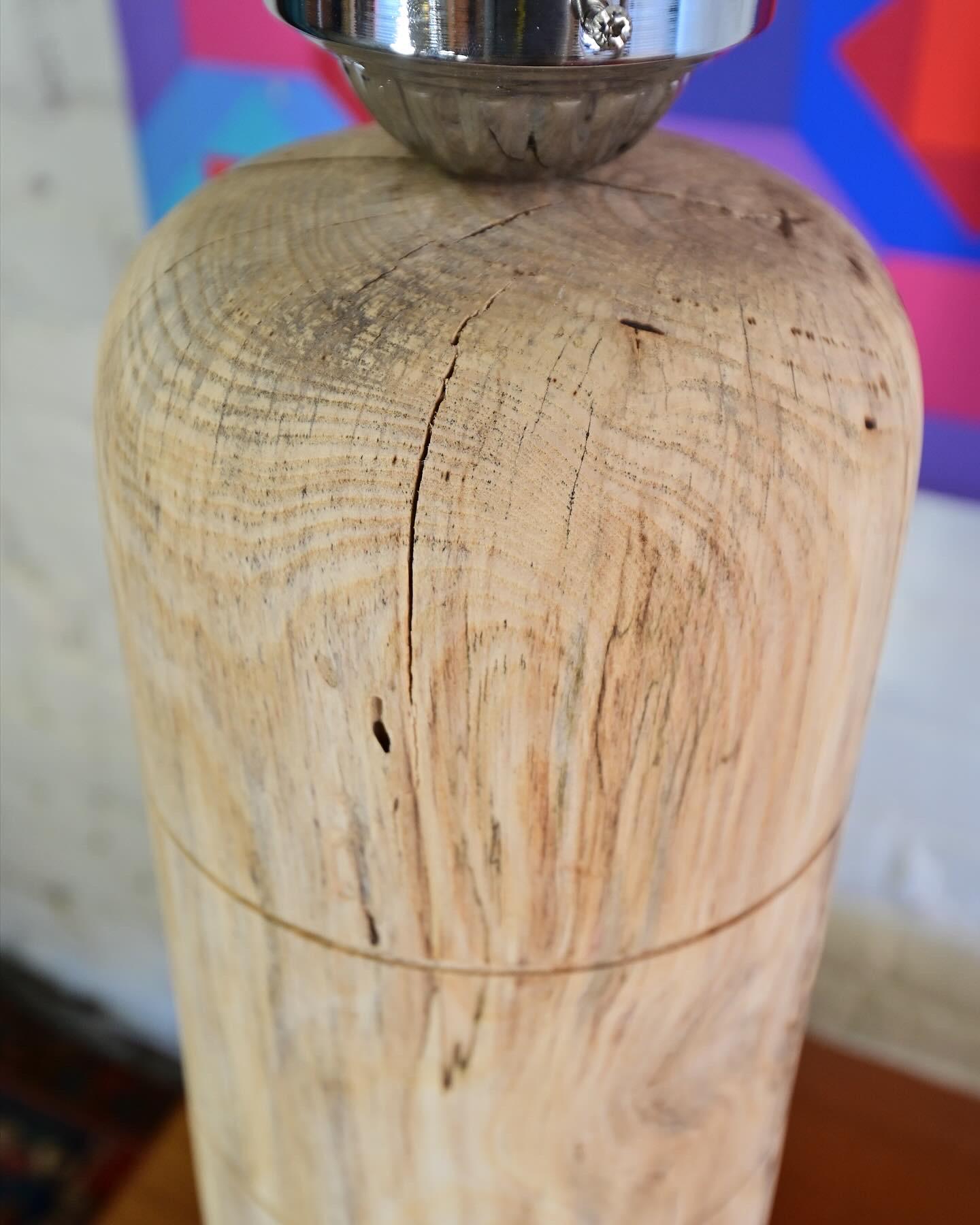 This is a solid wood table lamp made from spalted hackberry, part of our capsule line of products. This lamp will accentuate any modern interior. It is a hand turned piece on the lathe; has on/off switch on cord and comes with high efficiency led