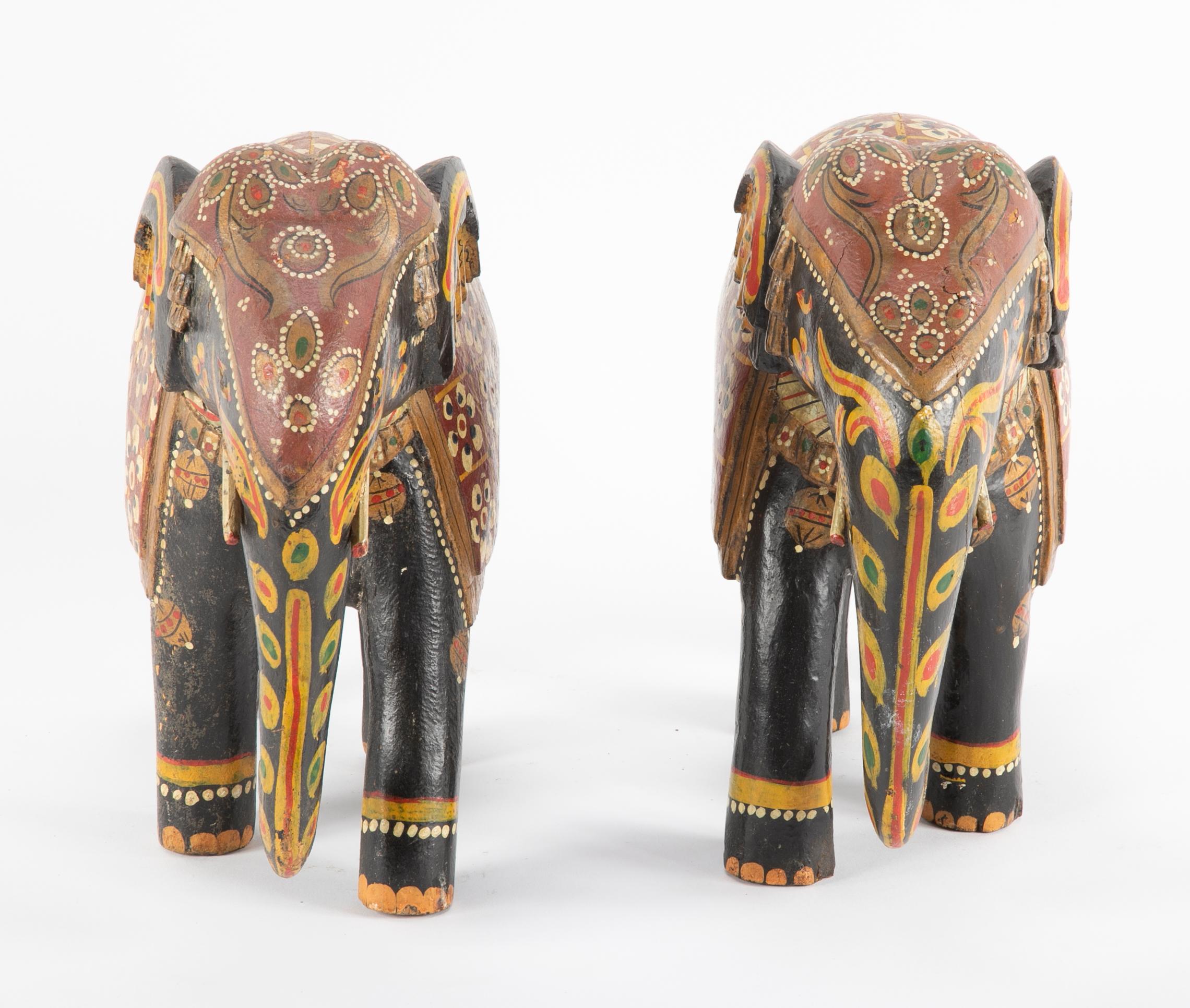 A wood carved pair of Asian elephants purchased in the 1930s,

circa 1920s-1930s. 

Measures: 11.5 H x 12.5 W x 4.5 D.