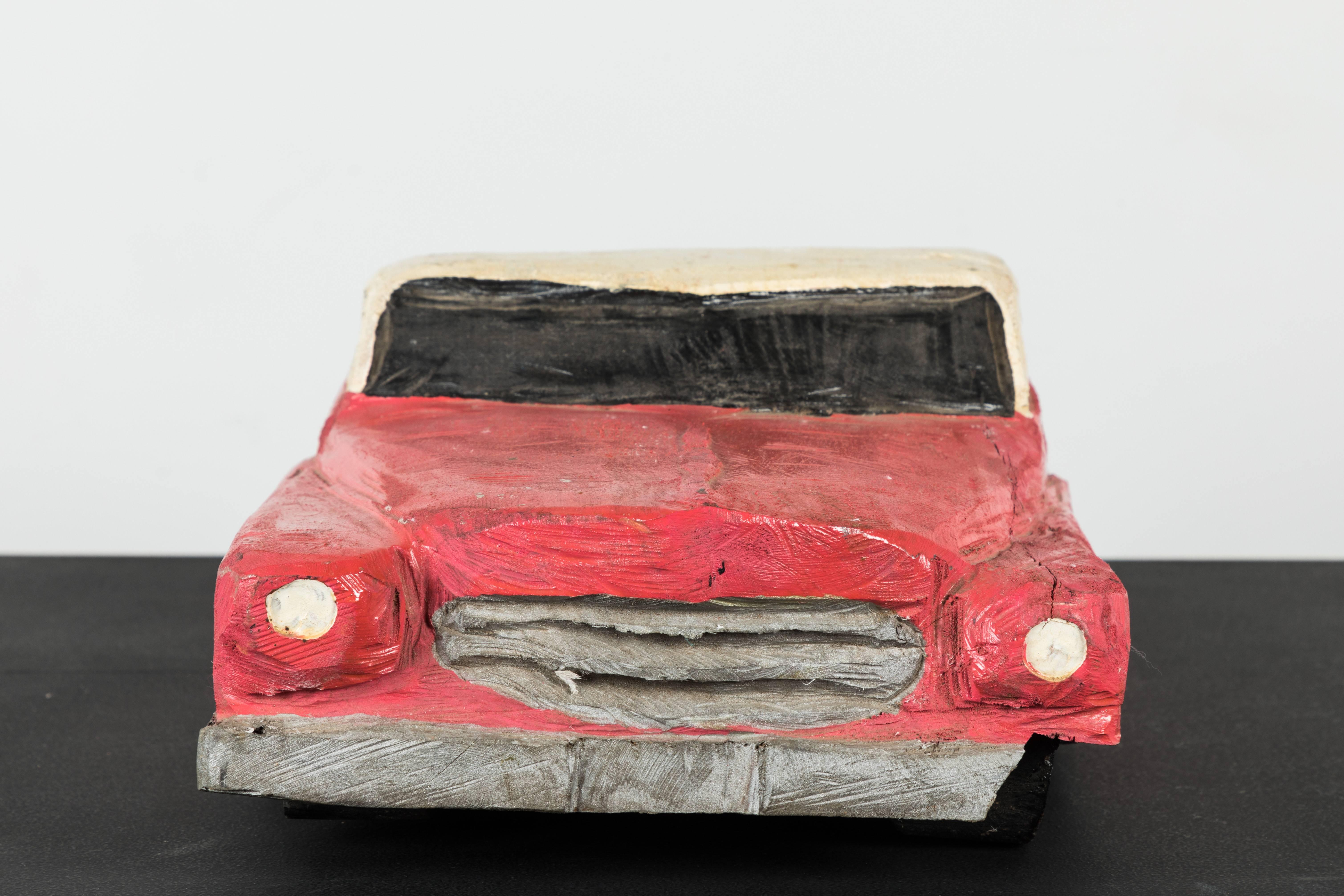 Hand-carved Folk Art pink and white midcentury car. Fun display piece. Quite a heavy piece.