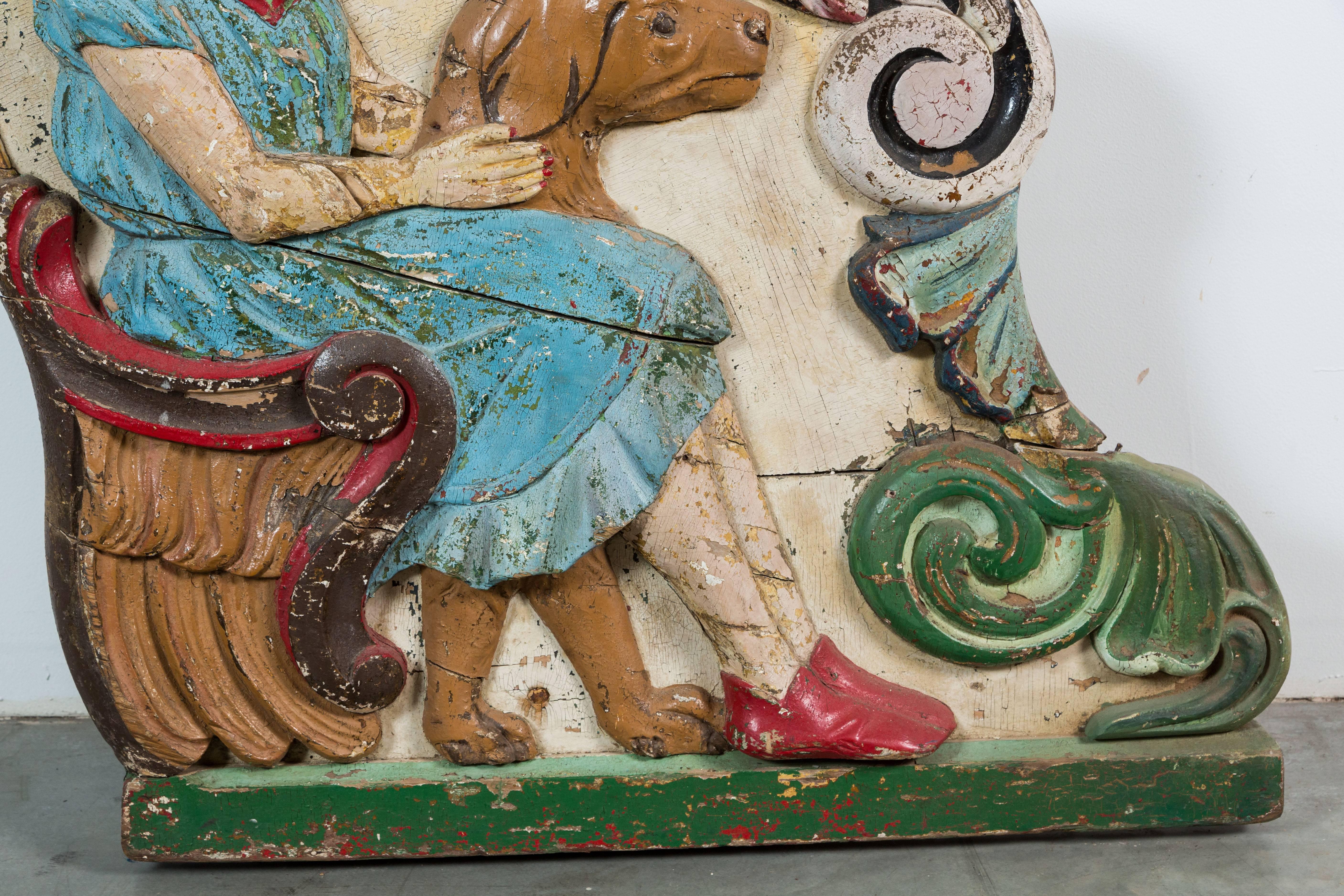 Américain Peinture d'origine en bois sculpté d'art populaire représentant une jeune fille et un char de manège avec un chien en vente
