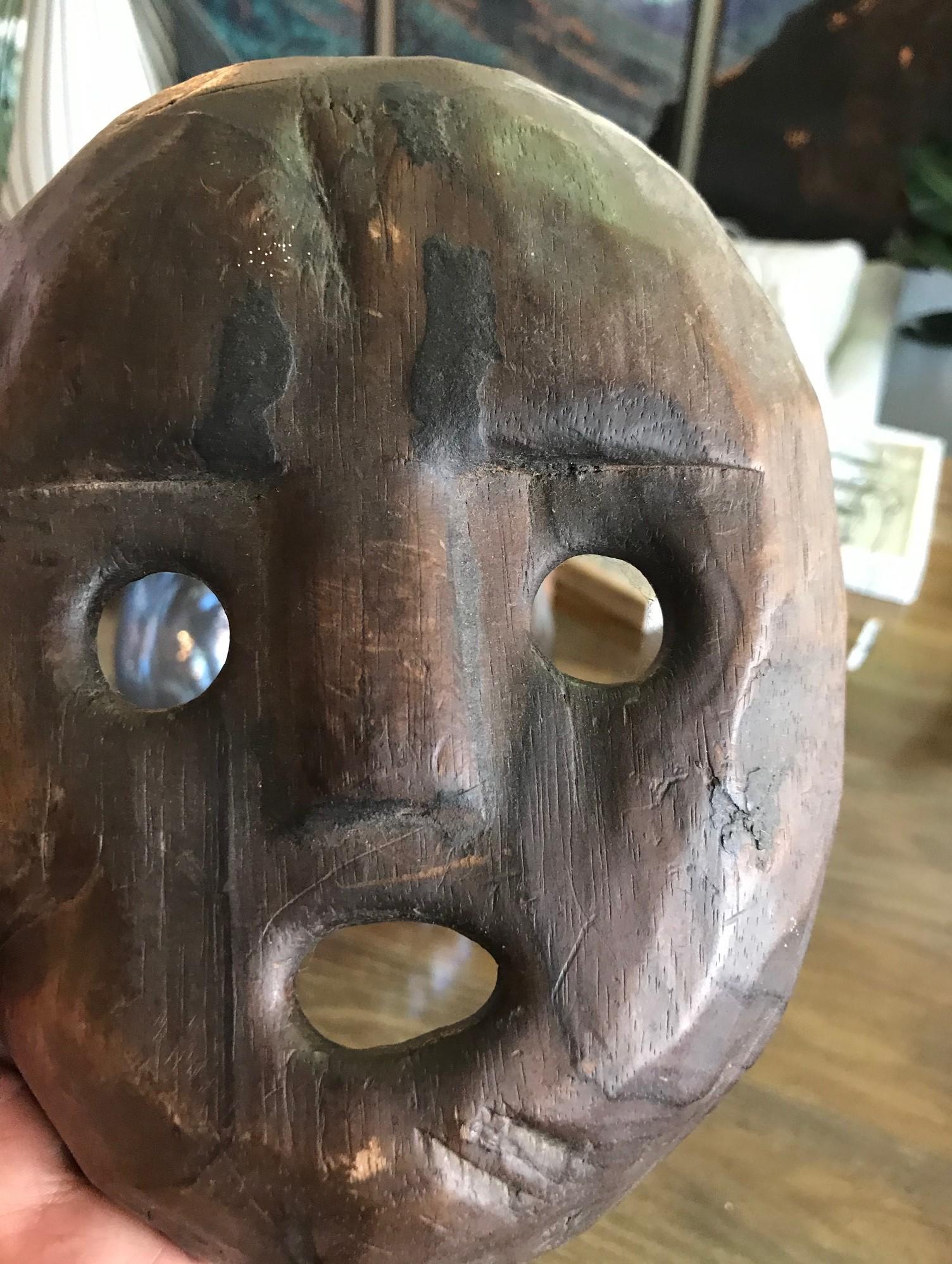 A fanciful hand carved folk mask of unknown origin. Made of light wood. 

A nice addition to any collection or wonderful accent piece. 

Dimensions: 8.5