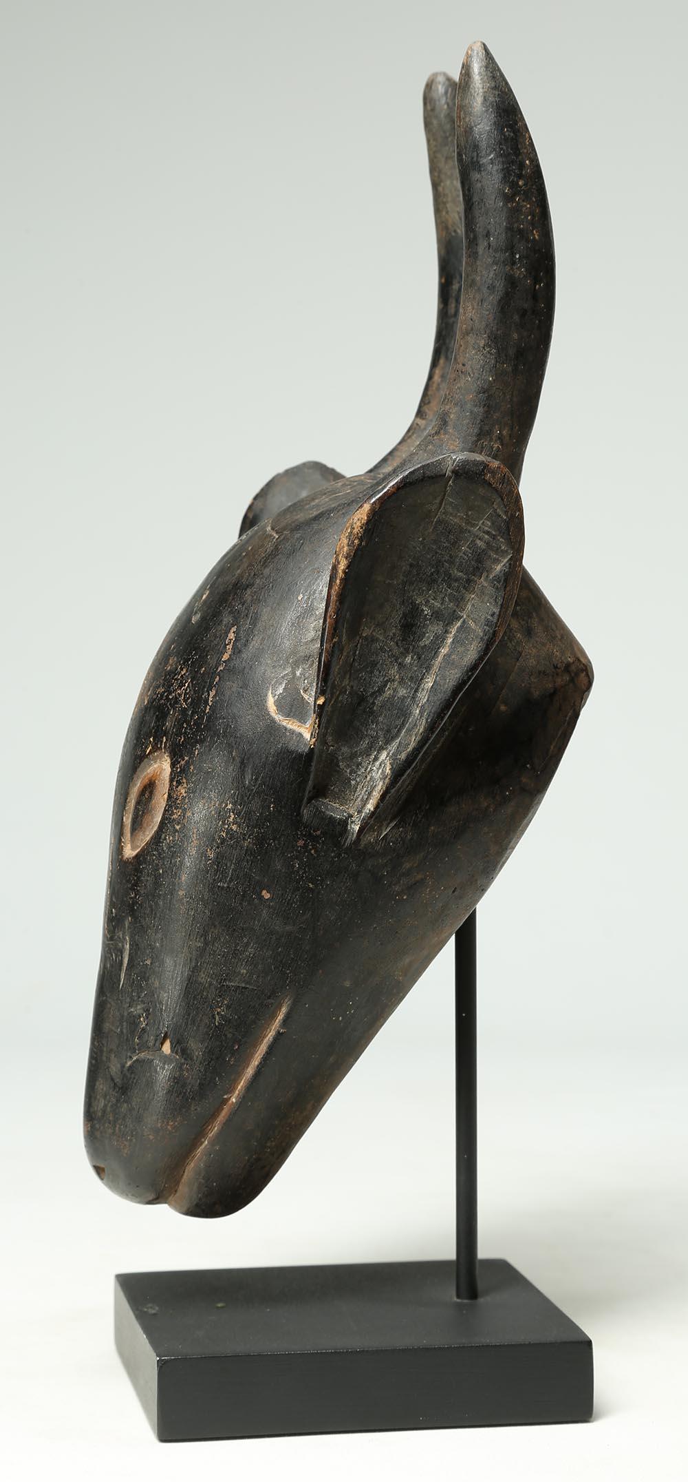 Wood Carved Tribal Miniature Antelope Mask, Guro, Ivory Coast, Africa on Stand In Good Condition In Point Richmond, CA