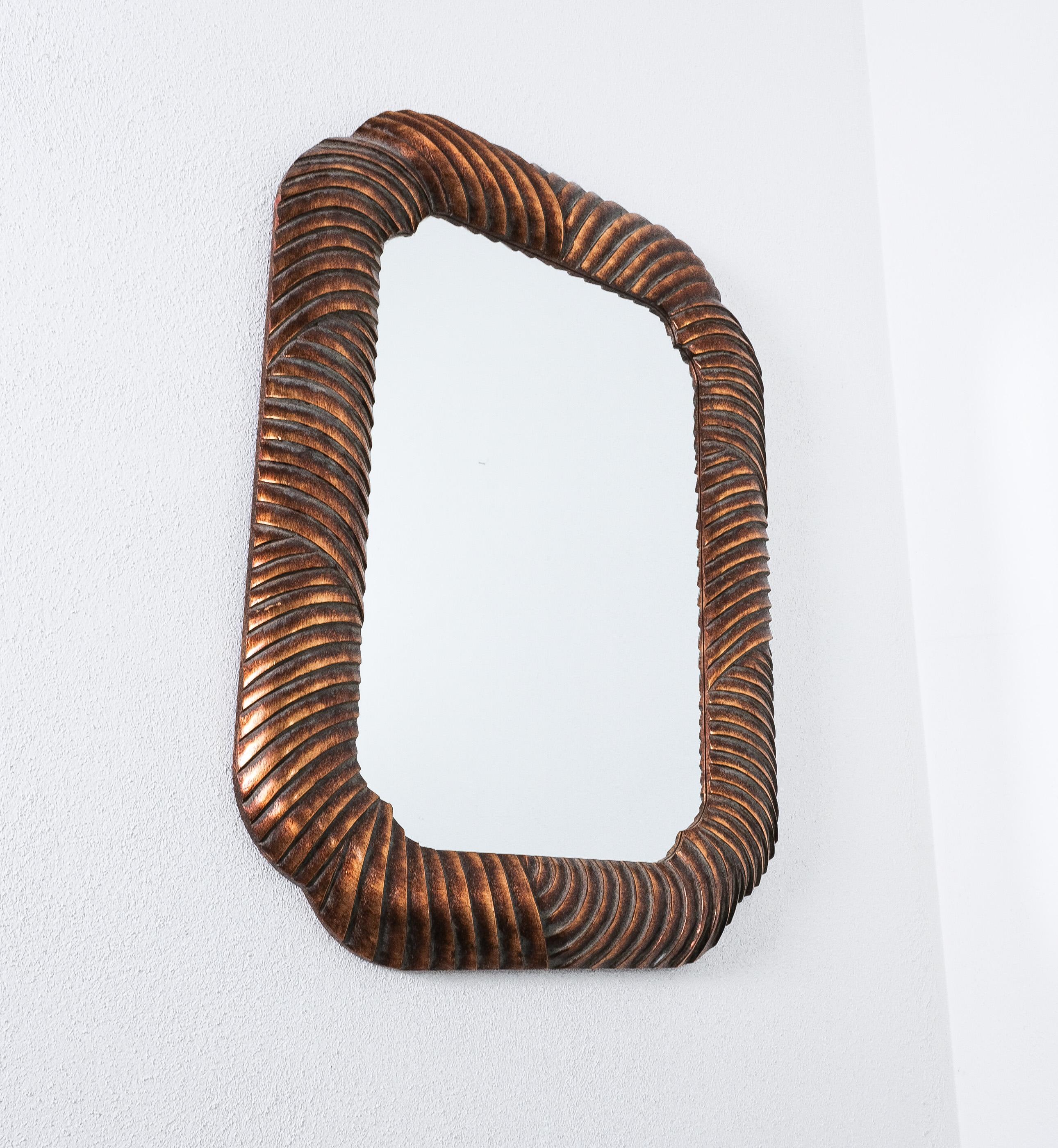 Bronzed Wood carved Trompe L’oeil Wall Mirror Bronze, Italy, circa 1970 For Sale