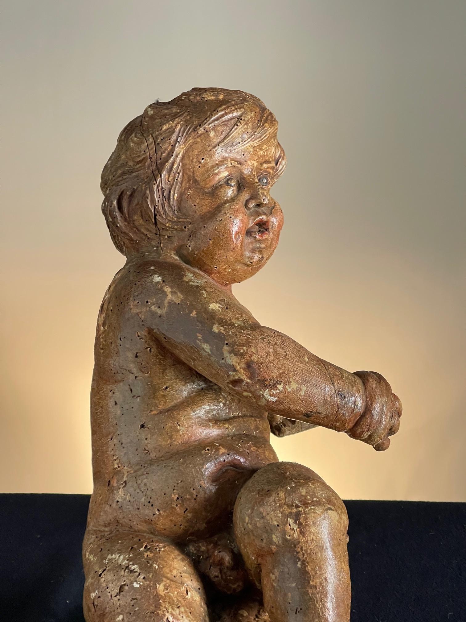 Wood carving of a putti Circa 1650 For Sale 1