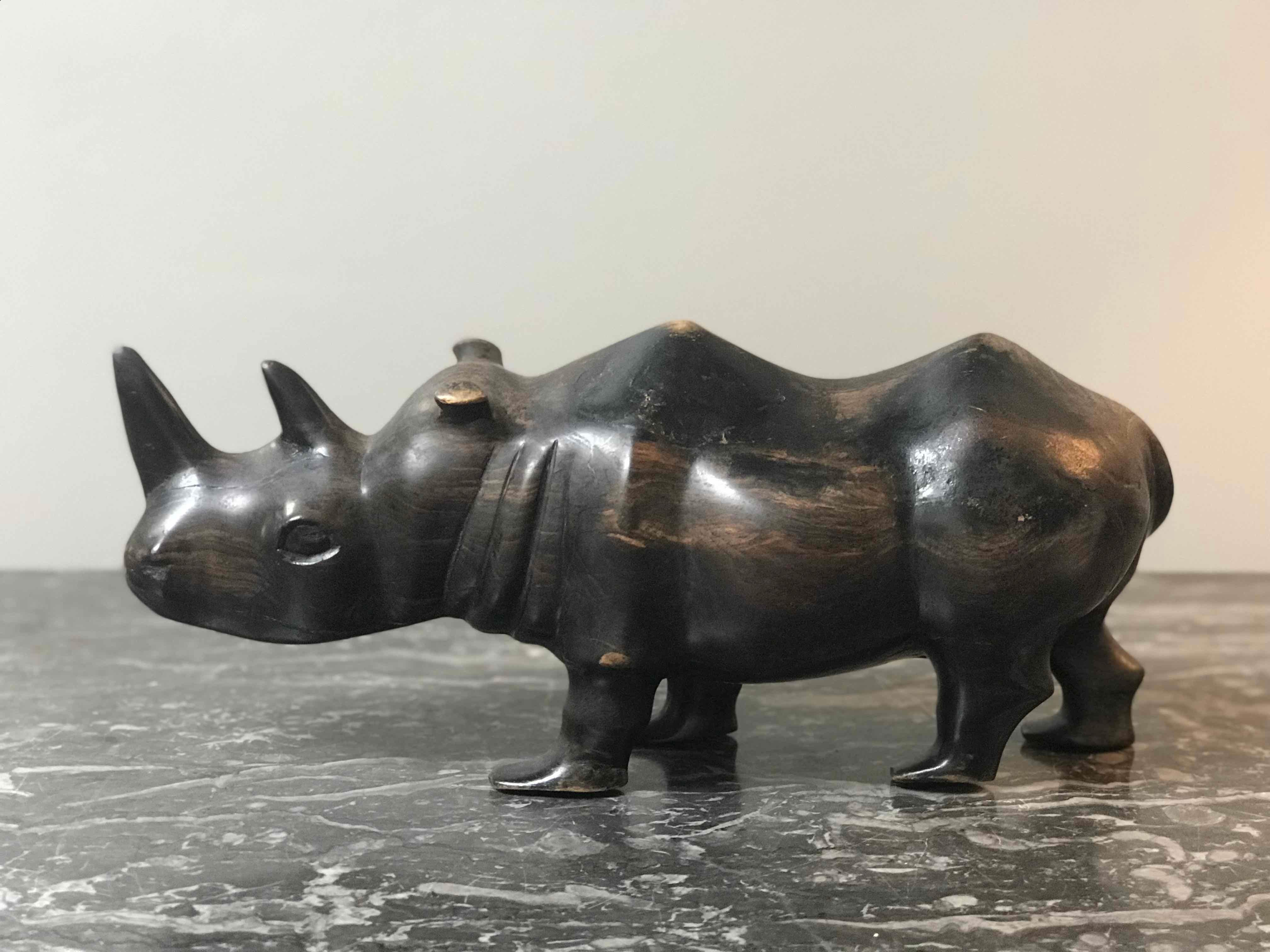 Wood carving of a rhino from mid-century England. 