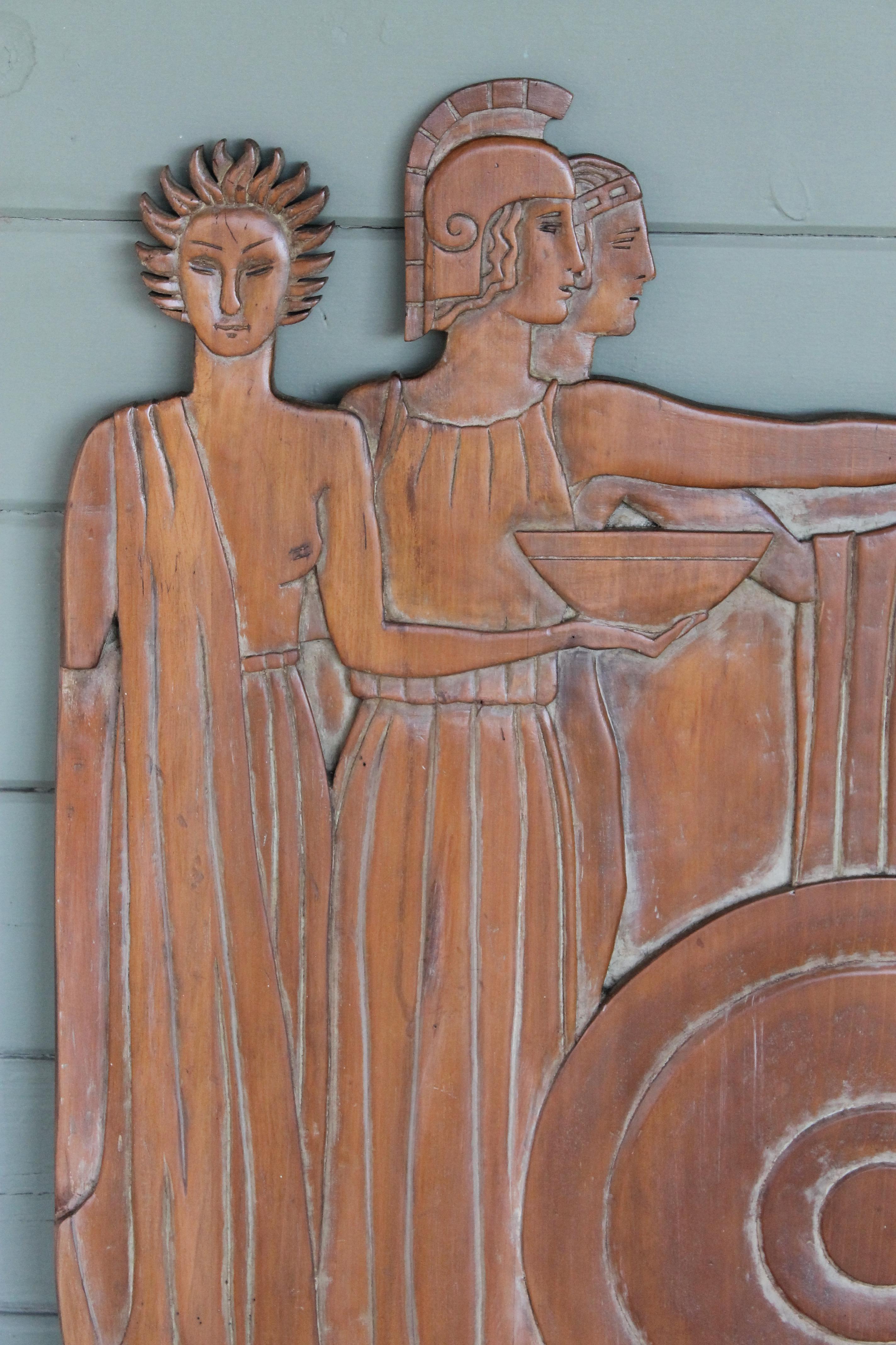A carved bas-relief of figures dressed in ancient Roman attire. Wood is a hardwood, possibly maple, and has a soft wash of pale grey visible in the recesses. It measures 28