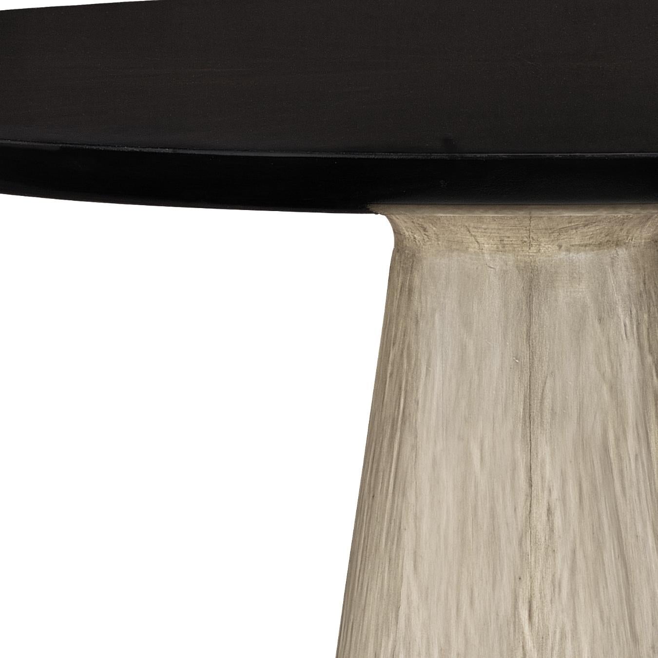 This circular occasional table with a conic base is perfect for any setting and comes in two different finishes.
  